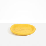 Dinosaur Designs Medium Bones Bowl in Pollen — mid sized handmade marbled yellow resin shallow serving bowl with a rounded organic form..