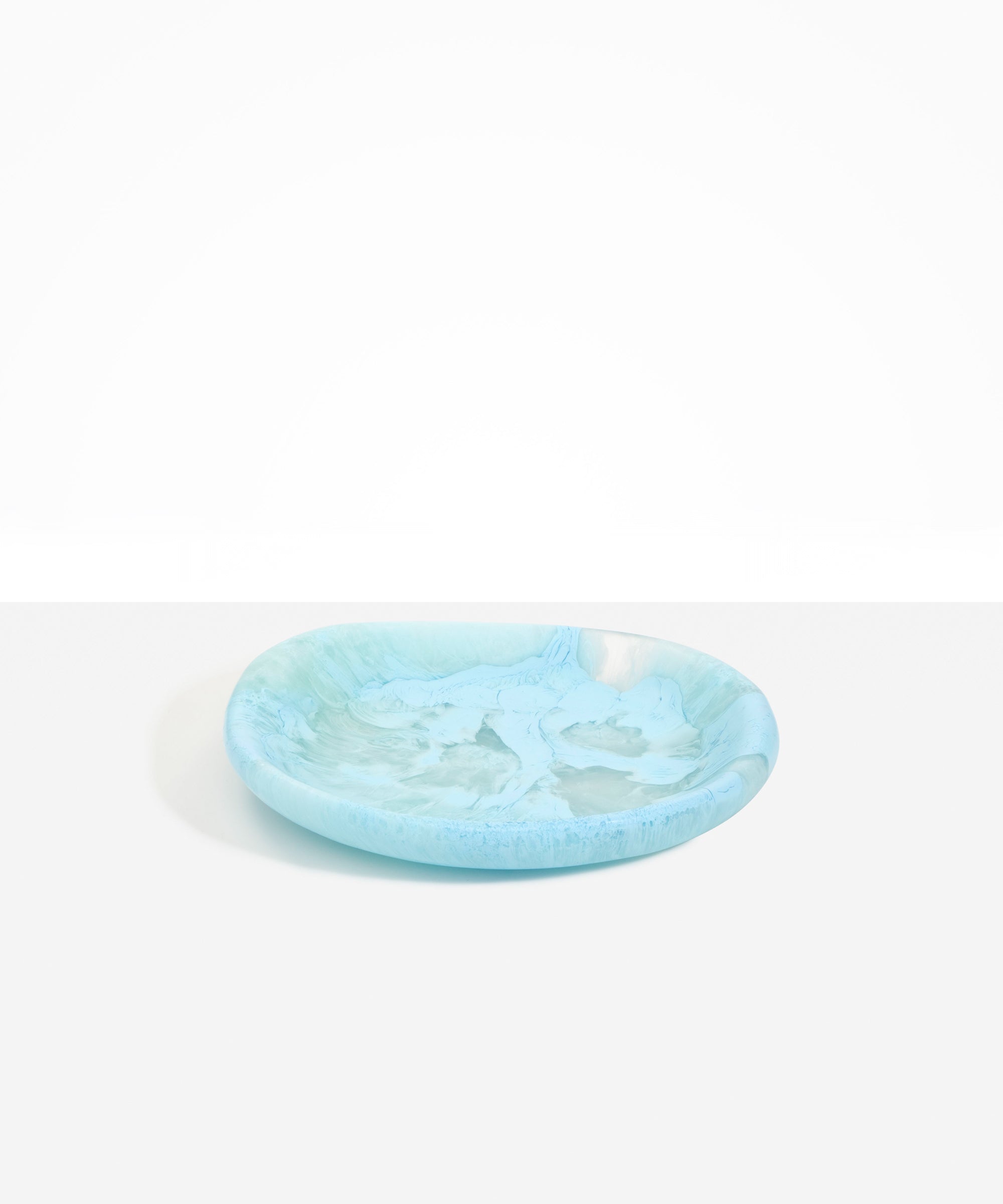 Dinosaur Designs Medium Bones Bowl in Pool — mid sized handmade marbled blue resin shallow serving bowl with a rounded organic form..