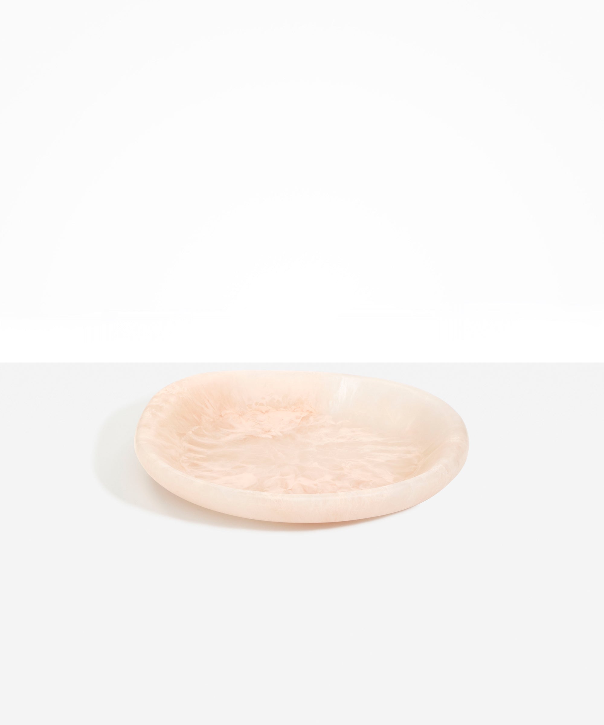 Dinosaur Designs Medium Bones Bowl in Rose Swirl — mid sized handmade pink resin shallow serving bowl with a rounded organic form..