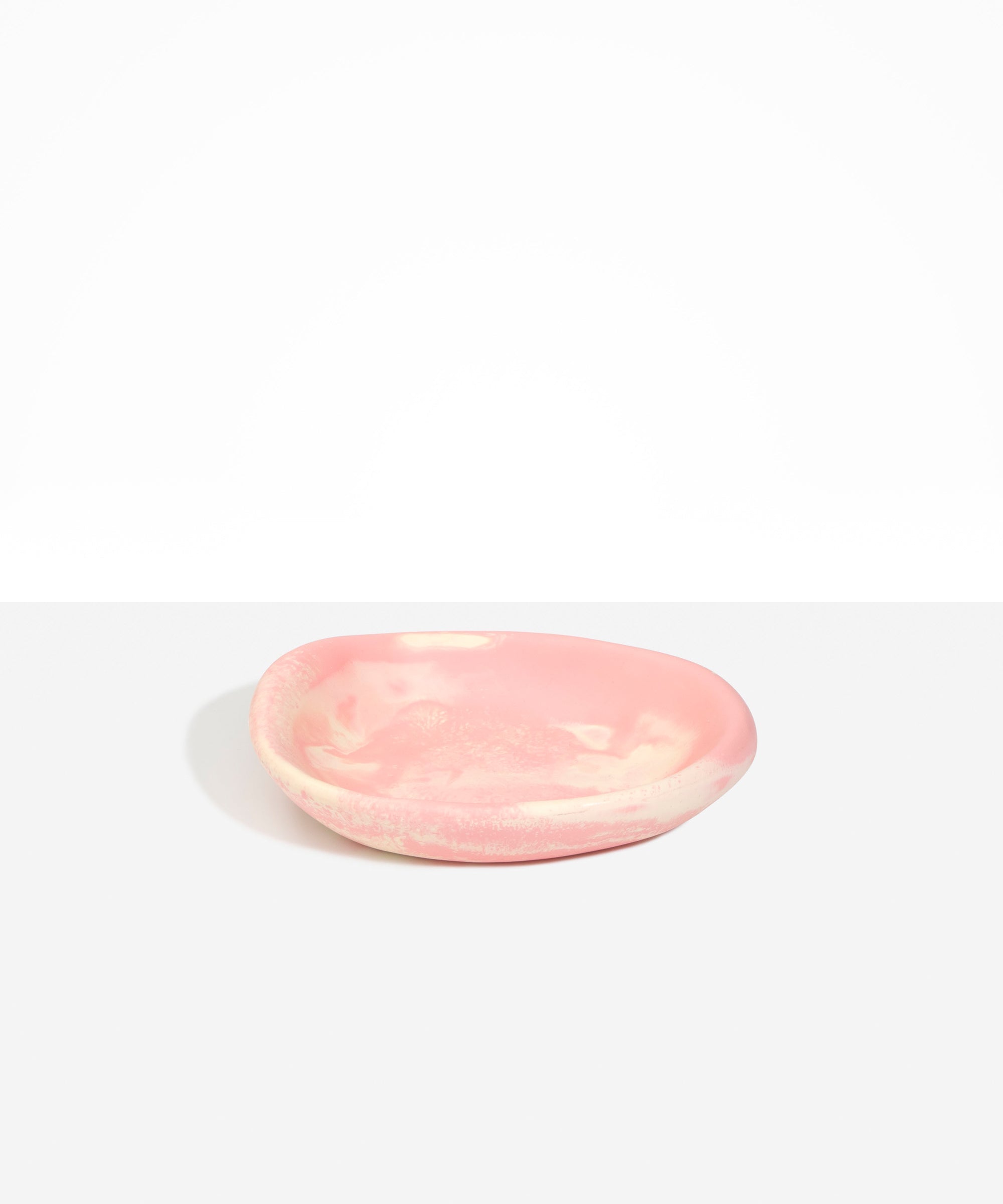 Dinosaur Designs Small Bones Bowl in Blossom — small handmade marbled pink and cream resin shallow serving bowl with a rounded organic form