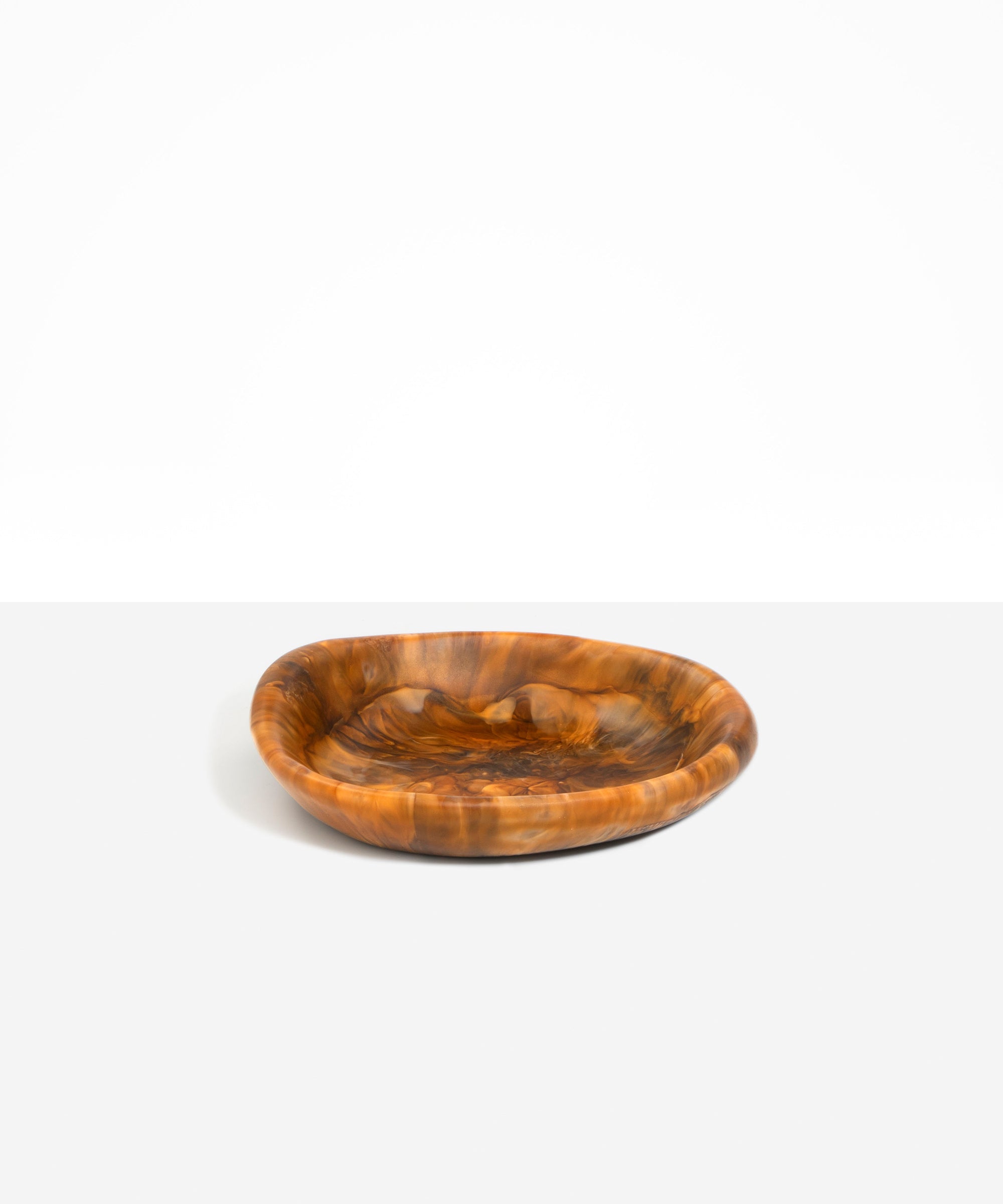 Dinosaur Designs Small Bones Bowl in Dark Horn — small handmade marbled brown, black and pearlescent gold resin shallow serving bowl with a rounded organic form