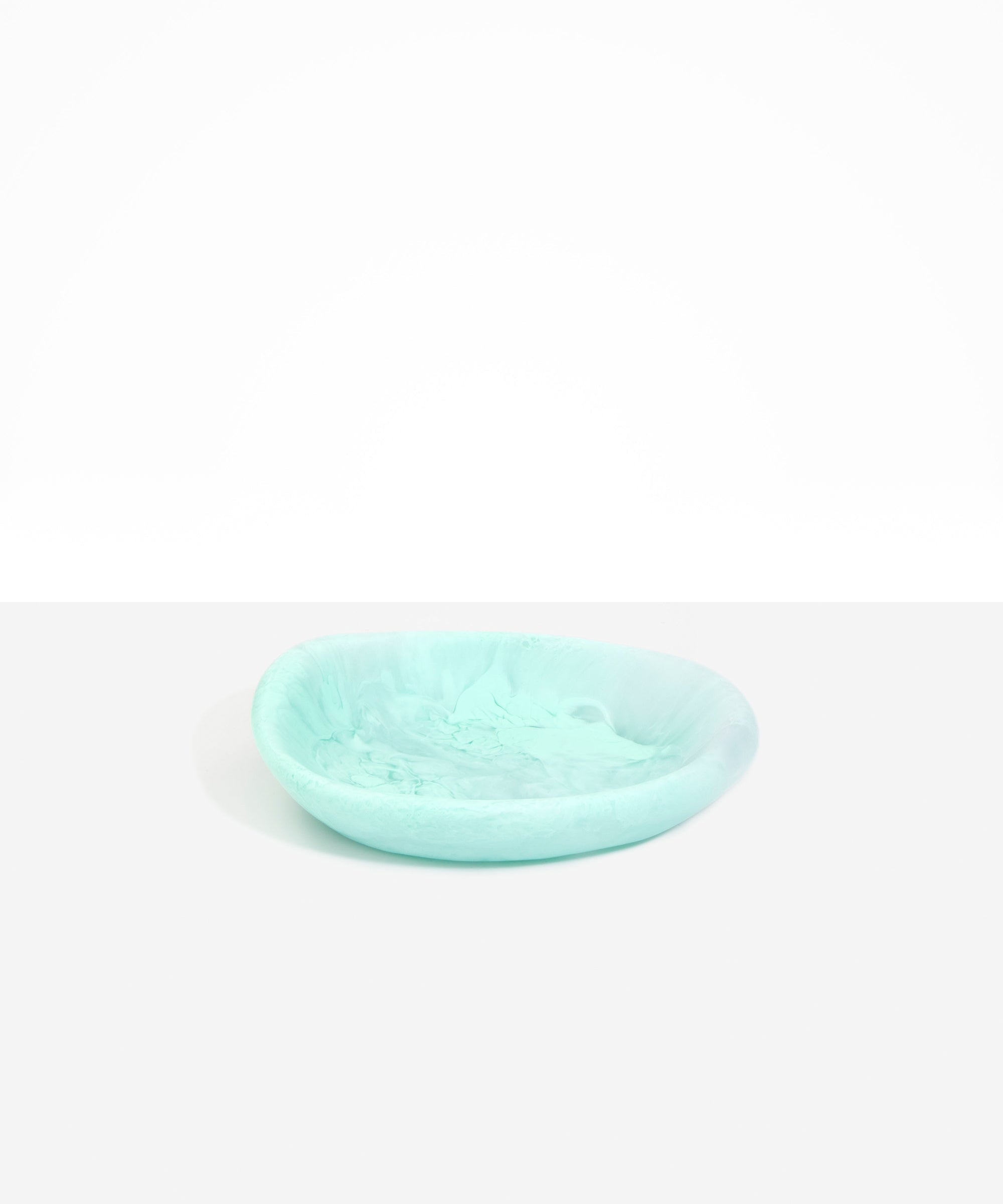 Dinosaur Designs Small Bones Bowl in Mint — small handmade marbled green blue resin shallow serving bowl with a rounded organic form