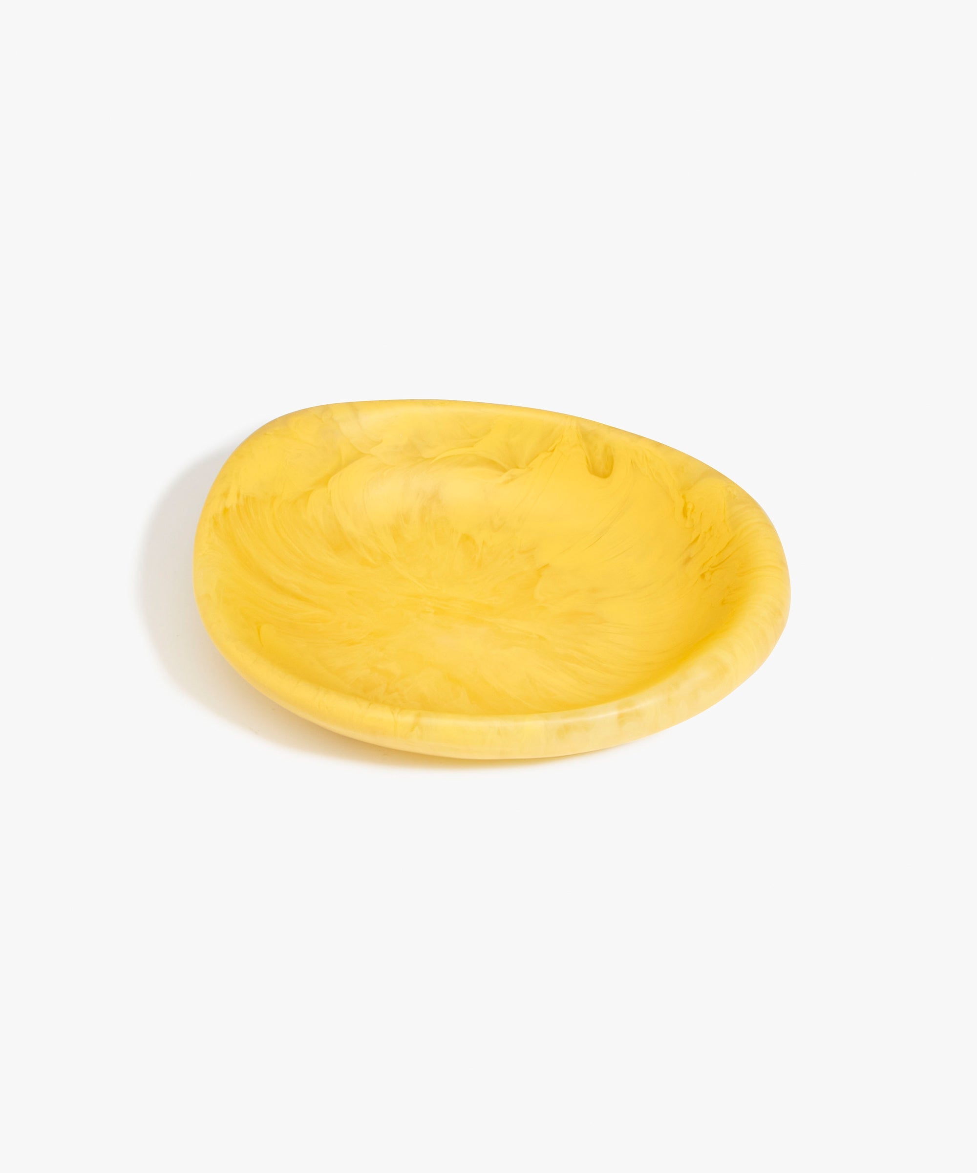 Dinosaur Designs Small Bones Bowl in Pollen — small handmade marbled yellow resin shallow serving bowl with a rounded organic form..