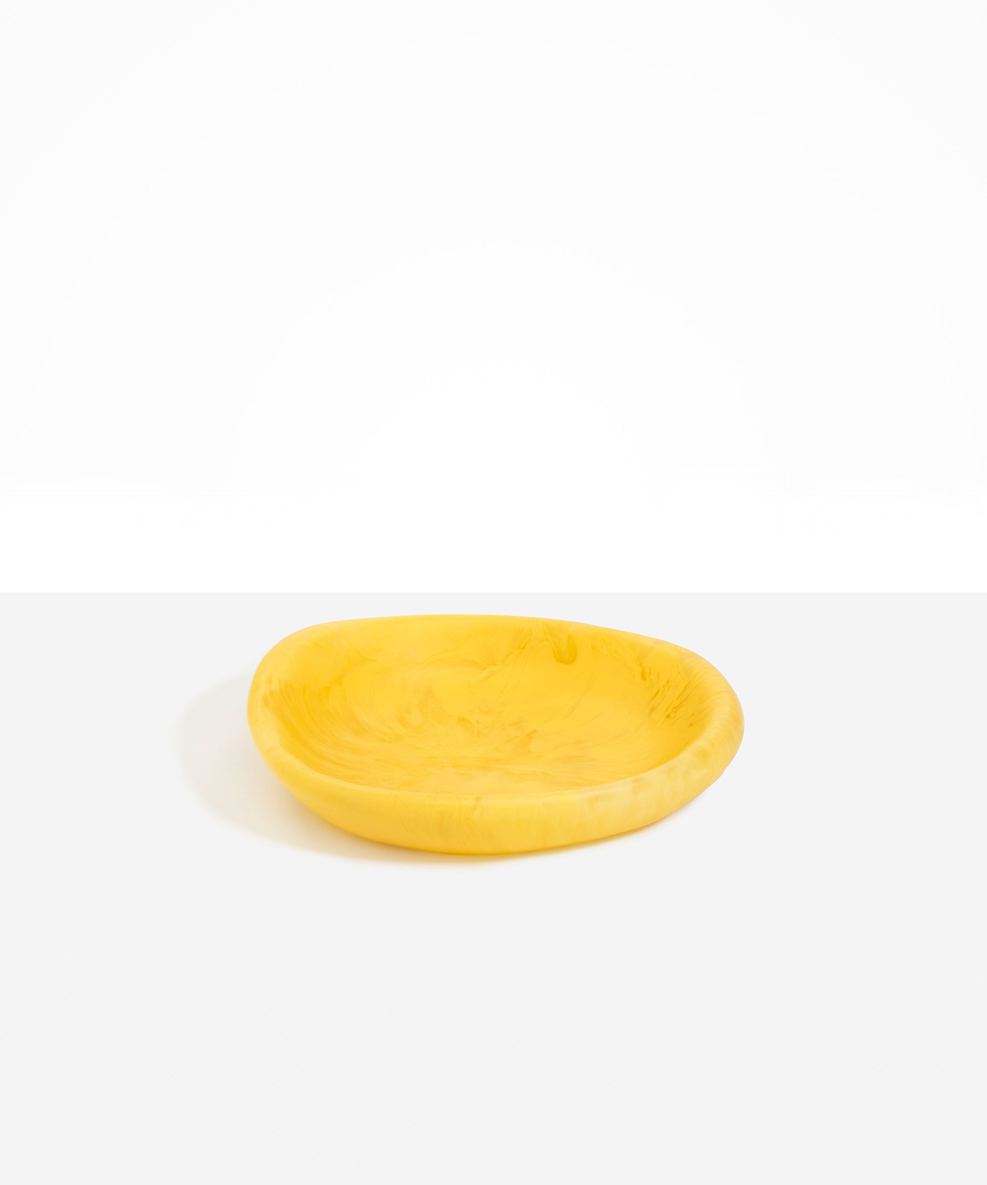 Dinosaur Designs Small Bones Bowl in Pollen — small handmade marbled yellow resin shallow serving bowl with a rounded organic form
