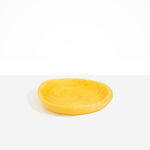 Dinosaur Designs Small Bones Bowl in Pollen — small handmade marbled yellow resin shallow serving bowl with a rounded organic form...