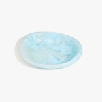 Dinosaur Designs Small Bones Bowl in Pool — small handmade marbled blue resin shallow serving bowl with a rounded organic form..