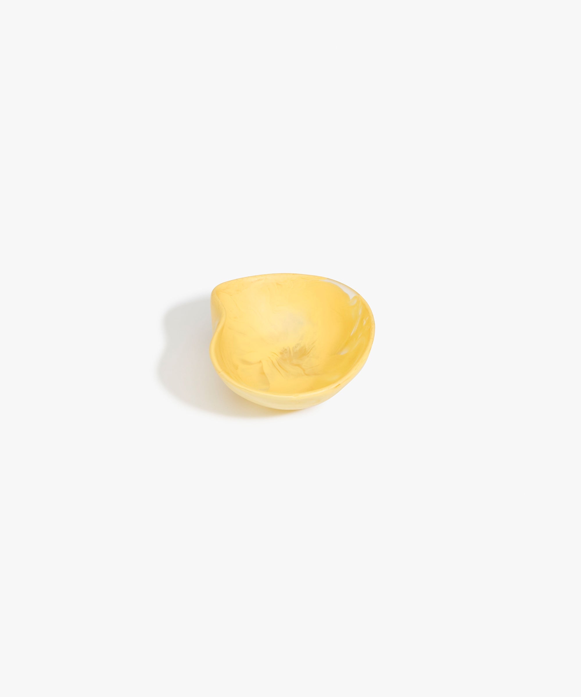 Dinosaur Designs Petal Dessert Bowl in Pollen — handcrafted marbled yellow resin bowl with curved form and pinched organic rim