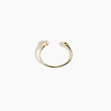 Dinosaur Designs Polished Lotus Cuff in Chalk Swirl with Brass — open brass cuff bracelet with asymmetric marbled off-white resin and polished brass teardrop