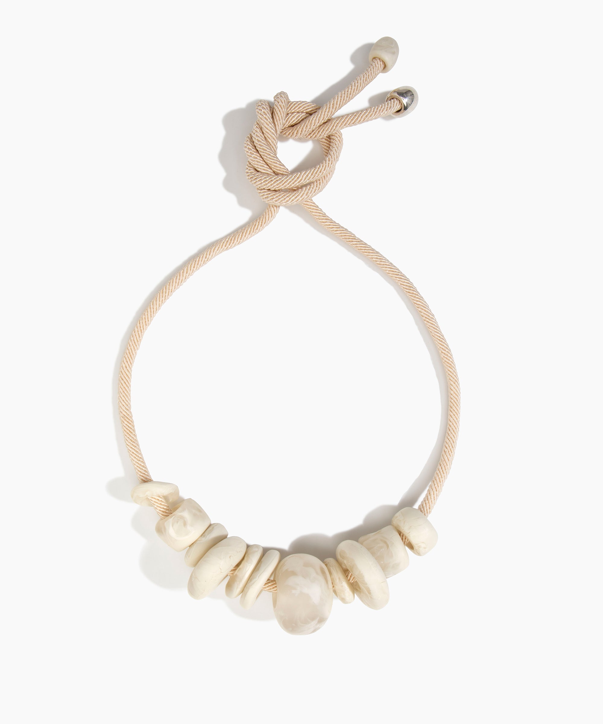 Dinosaur Designs Drift Choker in Chalk Swirl with Plated-Silver — marbled off-white resin pebble beads on a wood silk cord with silver-plated end cap