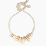 Dinosaur Designs Drift Choker in Cream with Plated-Silver — cream resin pebble beads on a wood silk cord with silver-plated end cap