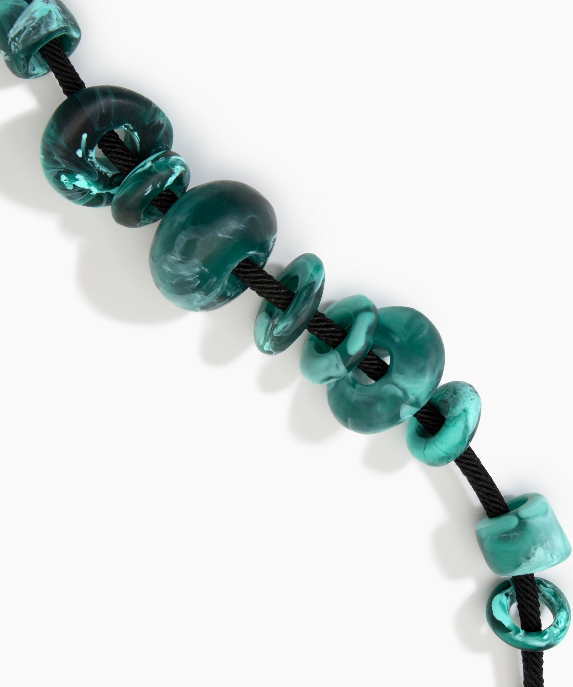 Dinosaur Designs Drift Choker in Lichen with Plated-Silver — marbled teal and black resin pebble beads on a wood silk cord with silver-plated end cap