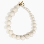 Dinosaur Designs Polished Organic Ball Choker in Chalk Swirl — handcrafted marbled off-white and clear polished resin graduating bead choker necklace with brass t-bar clasp