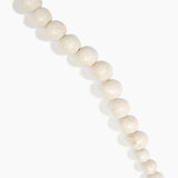 Dinosaur Designs Polished Organic Ball Choker in Chalk Swirl — handcrafted marbled off-white and clear polished resin graduating bead choker necklace with brass t-bar clasp