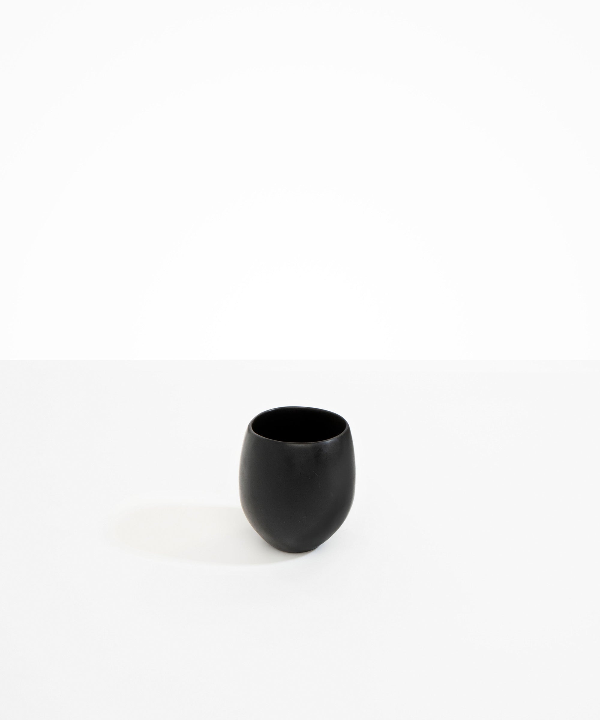 Dinosaur Designs Large Rock Cup in Black — handcrafted black resin cup with rounded bulbous form and open organic rim