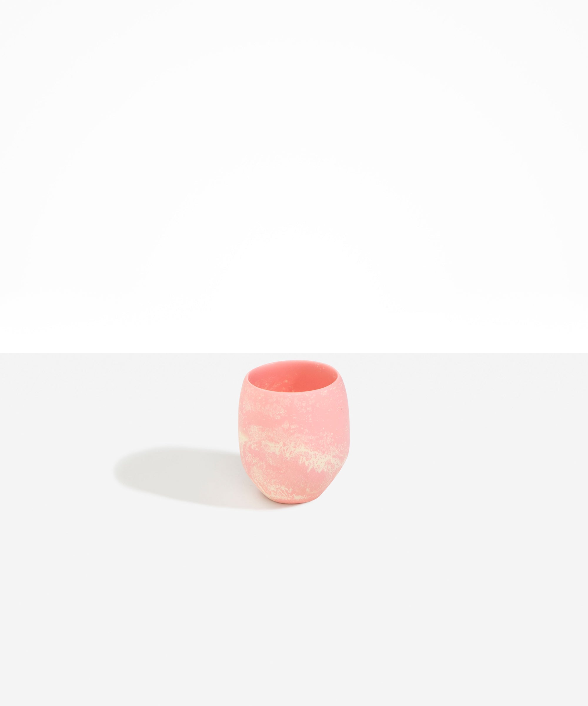 Dinosaur Designs Large Rock Cup in Blossom — handcrafted marbled pink and cream resin cup with rounded bulbous form and open organic rim