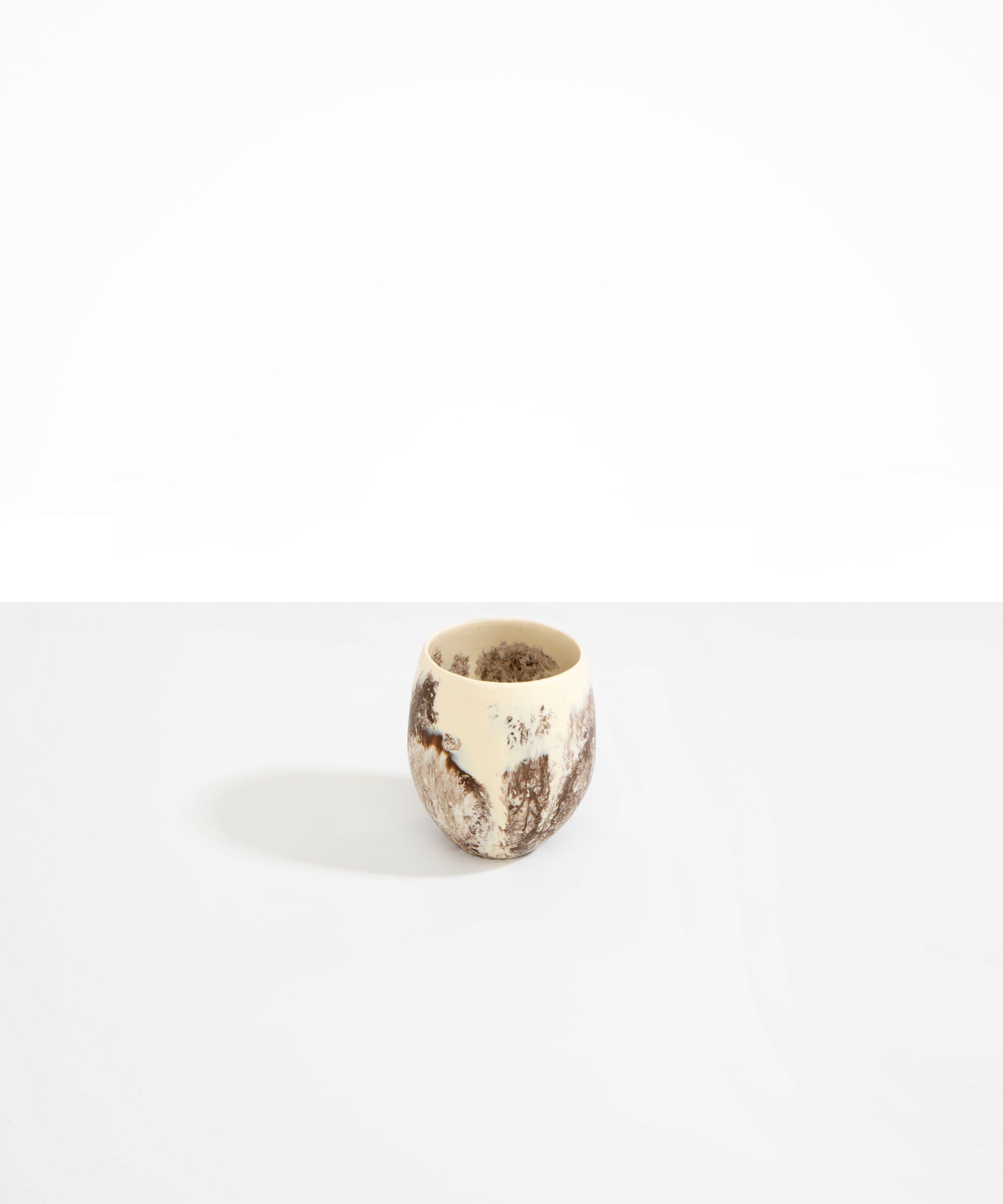 Dinosaur Designs Large Rock Cup in Cappuccino — handcrafted marbled brown and cream resin cup with rounded bulbous form and open organic rim