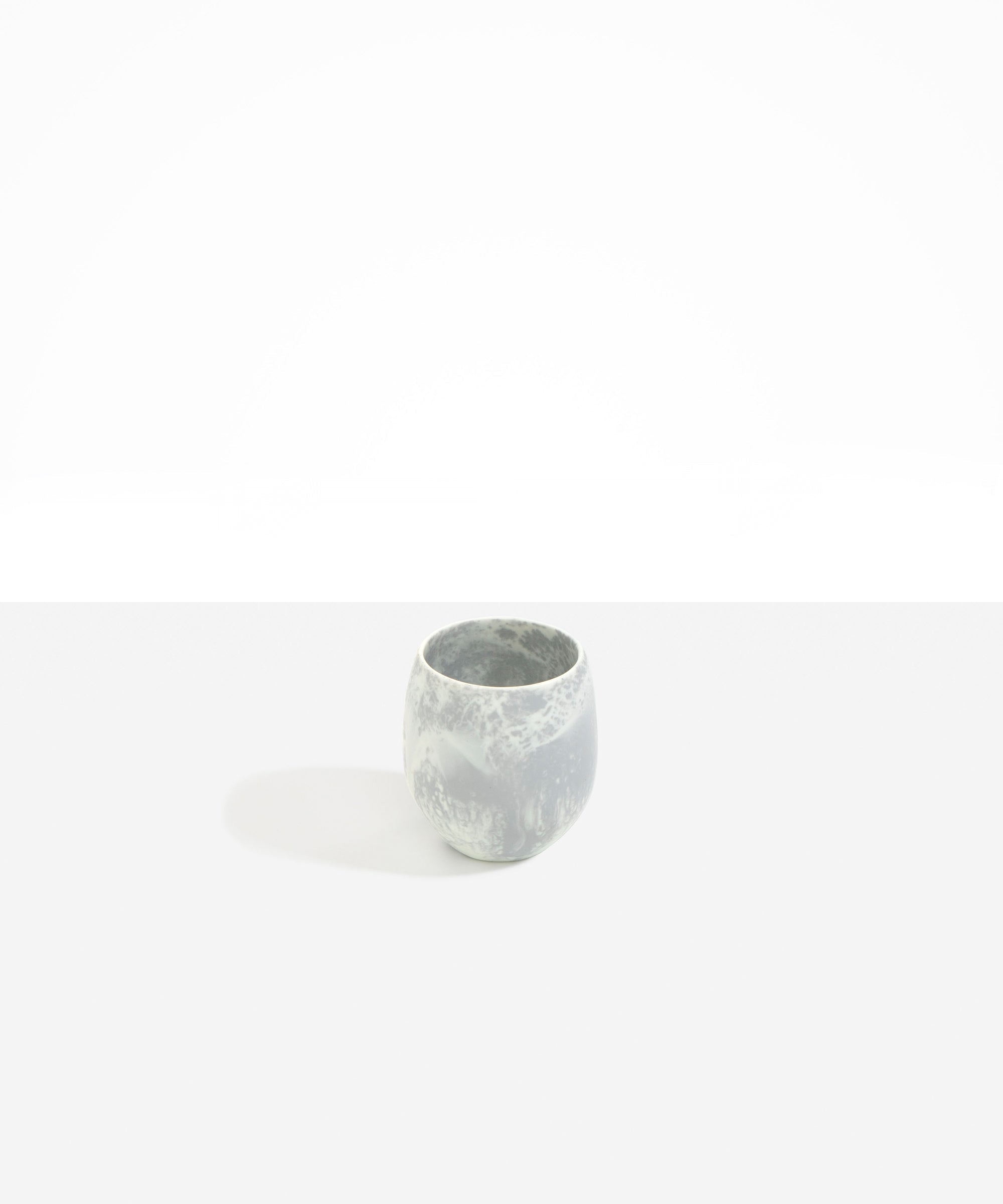Dinosaur Designs Large Rock Cup in Cloud — handcrafted marbled grey and cream resin cup with rounded bulbous form and open organic rim..