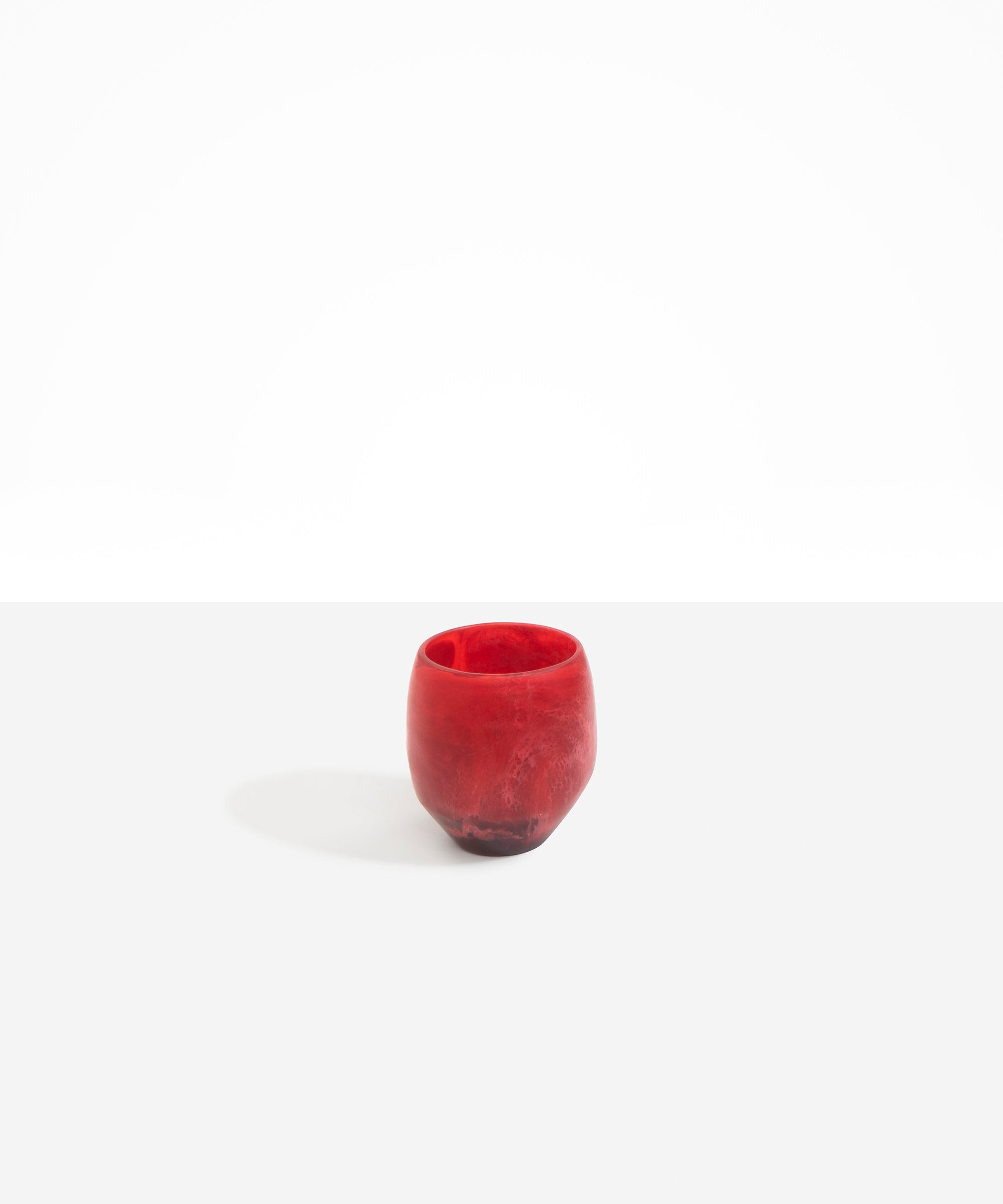 Dinosaur Designs Large Rock Cup in Cranberry — handcrafted marbled red and transparent resin cup with rounded bulbous form and open organic rim