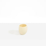 Dinosaur Designs Large Rock Cup in Cream — handcrafted cream resin cup with rounded bulbous form and open organic rim