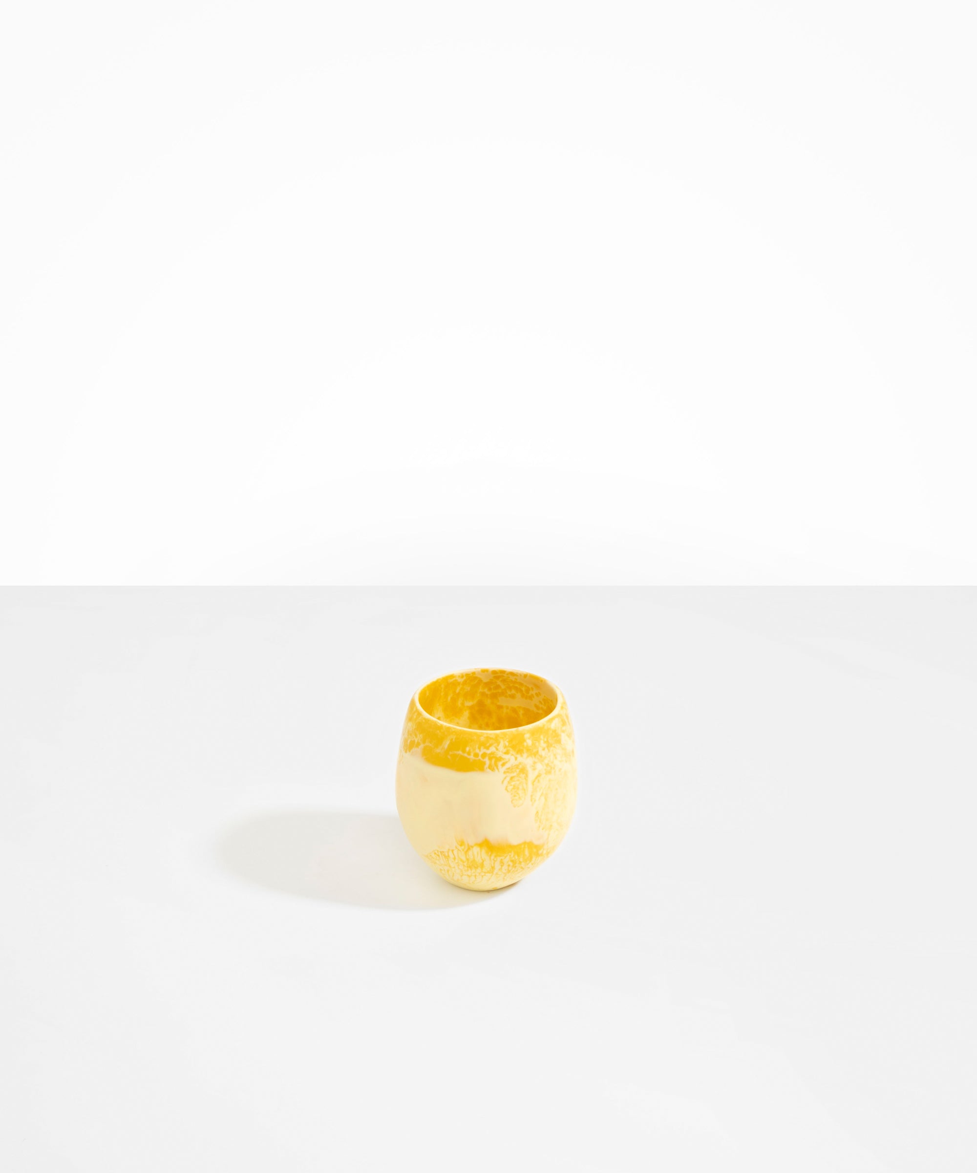 Dinosaur Designs Large Rock Cup in Yellow — handcrafted marbled yellow resin cup with rounded bulbous form and open organic rim
