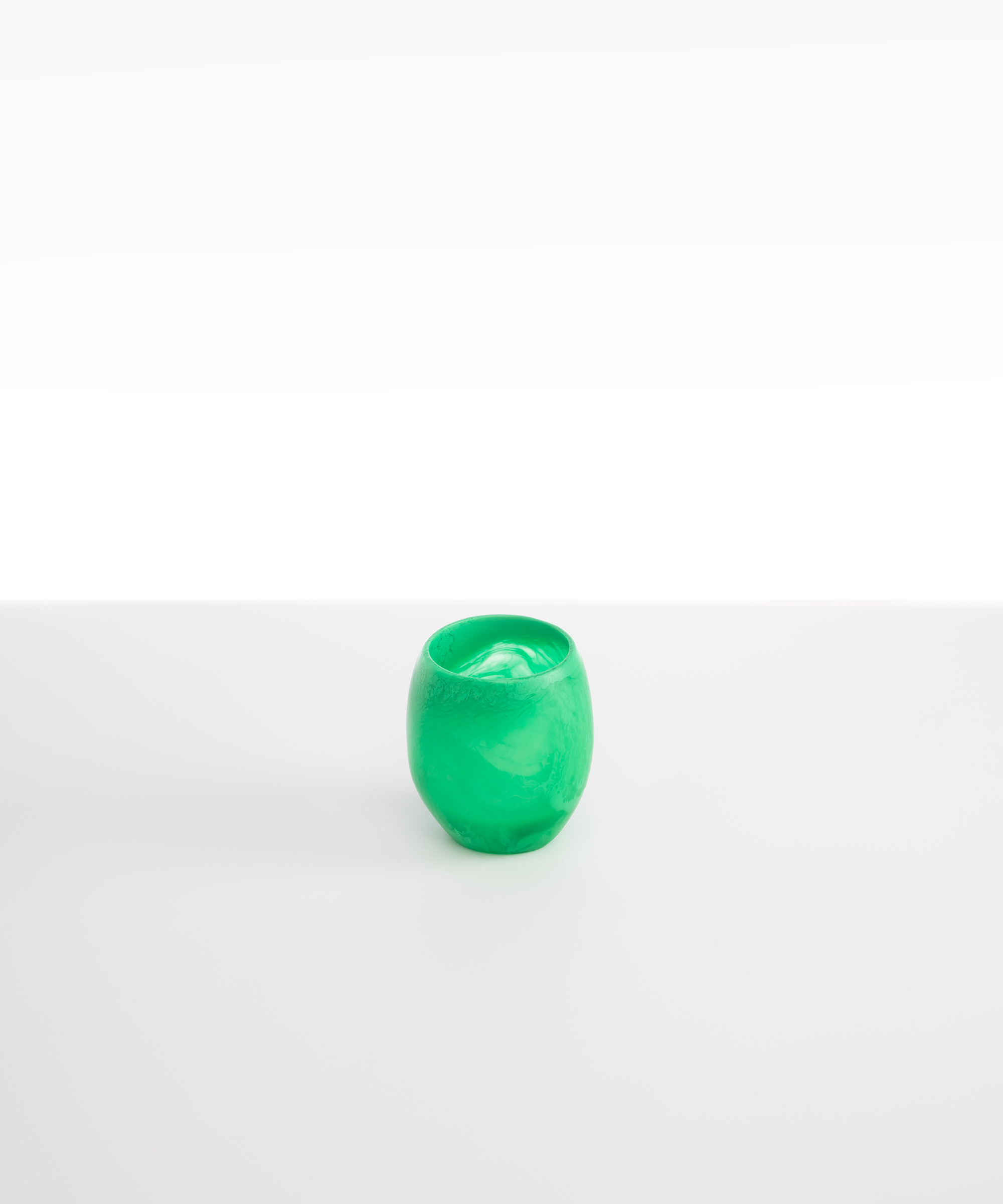 Dinosaur Designs Large Rock Cup in Leaf — handcrafted marbled green and transparent resin cup with rounded bulbous form and open organic rim