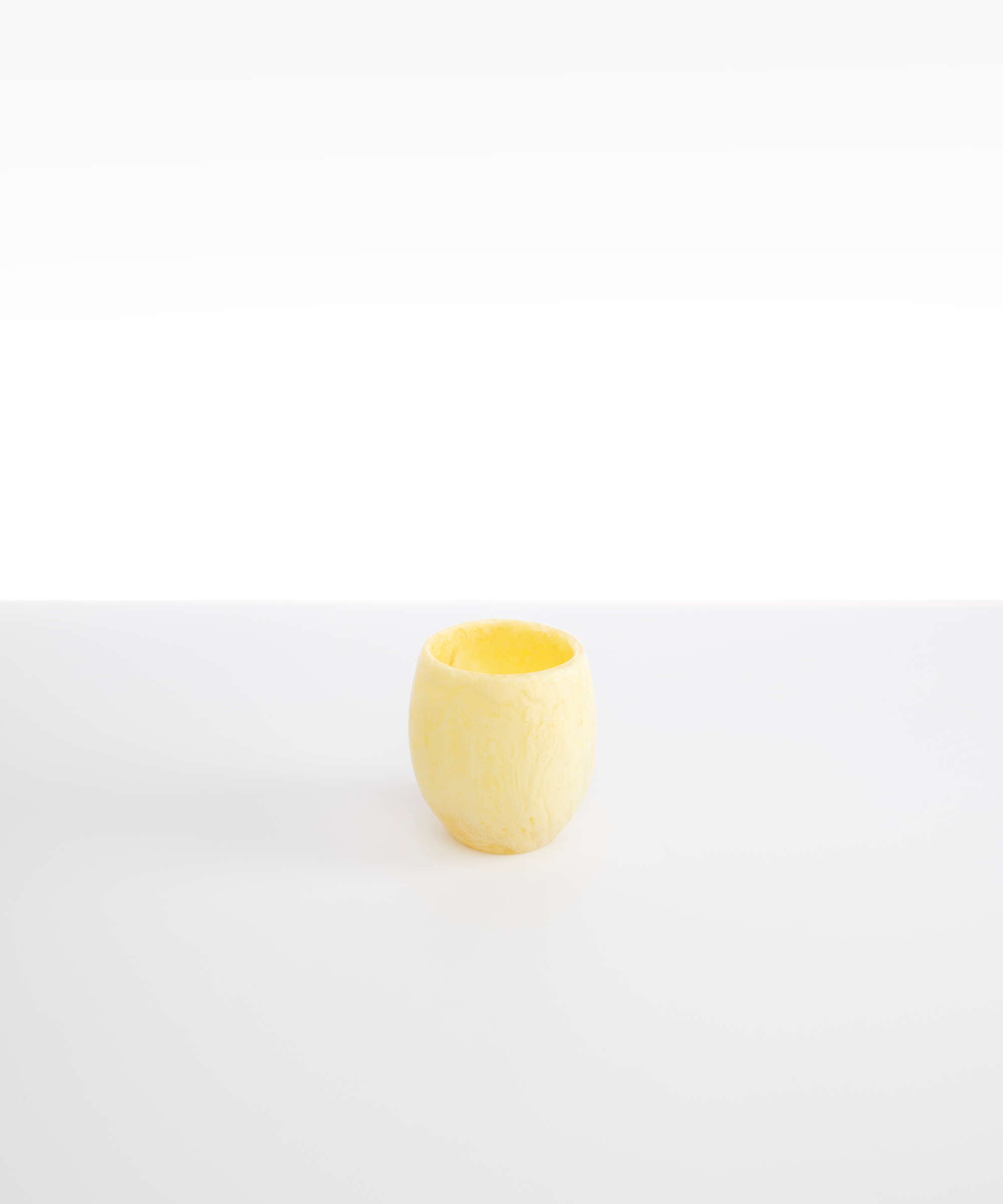 Dinosaur Designs Large Rock Cup in Lemon — handcrafted marbled yellow and transparent resin cup with rounded bulbous form and open organic rim
