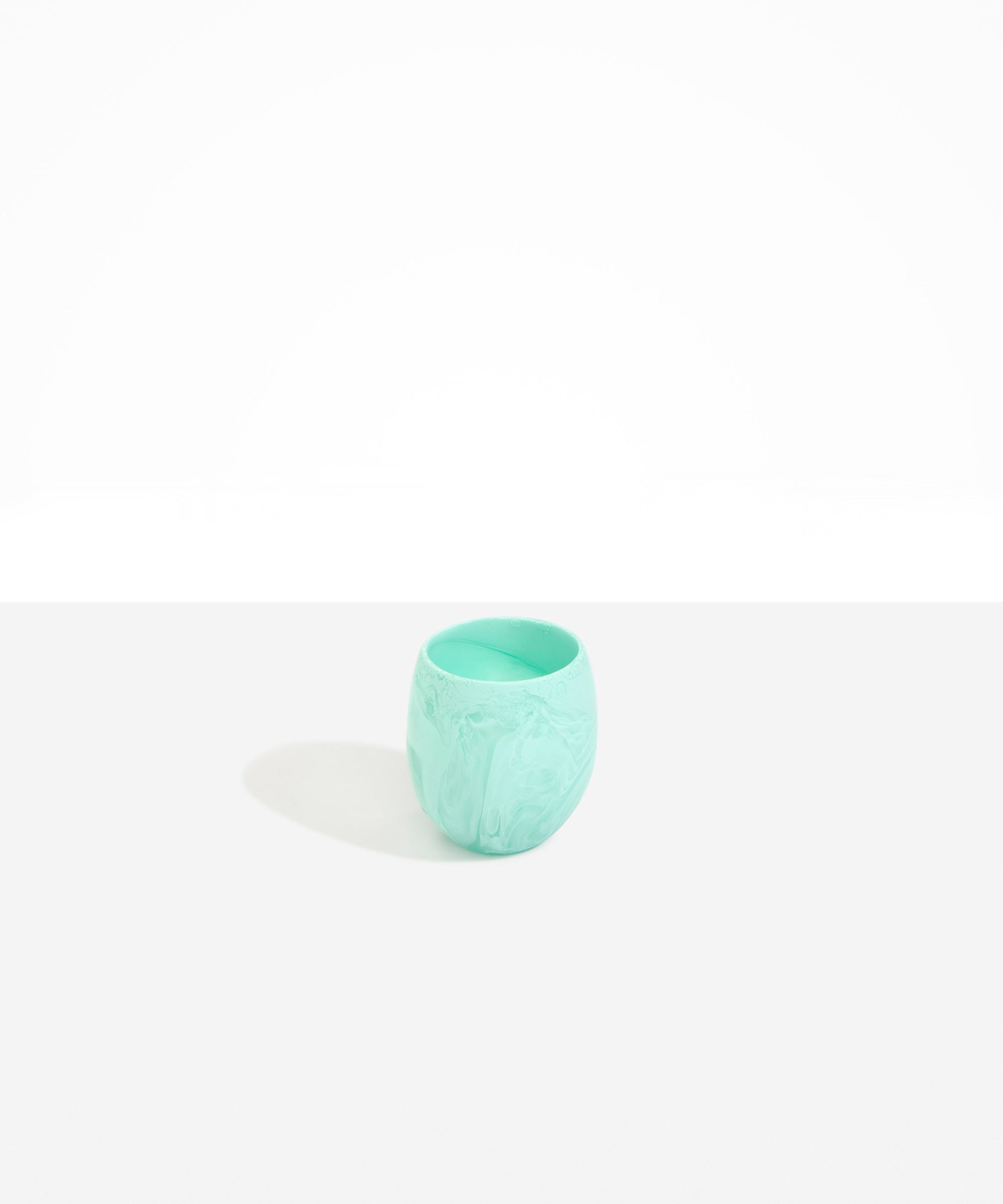 Dinosaur Designs Large Rock Cup in Mint — handcrafted marbled green blue and transparent resin cup with rounded bulbous form and open organic rim
