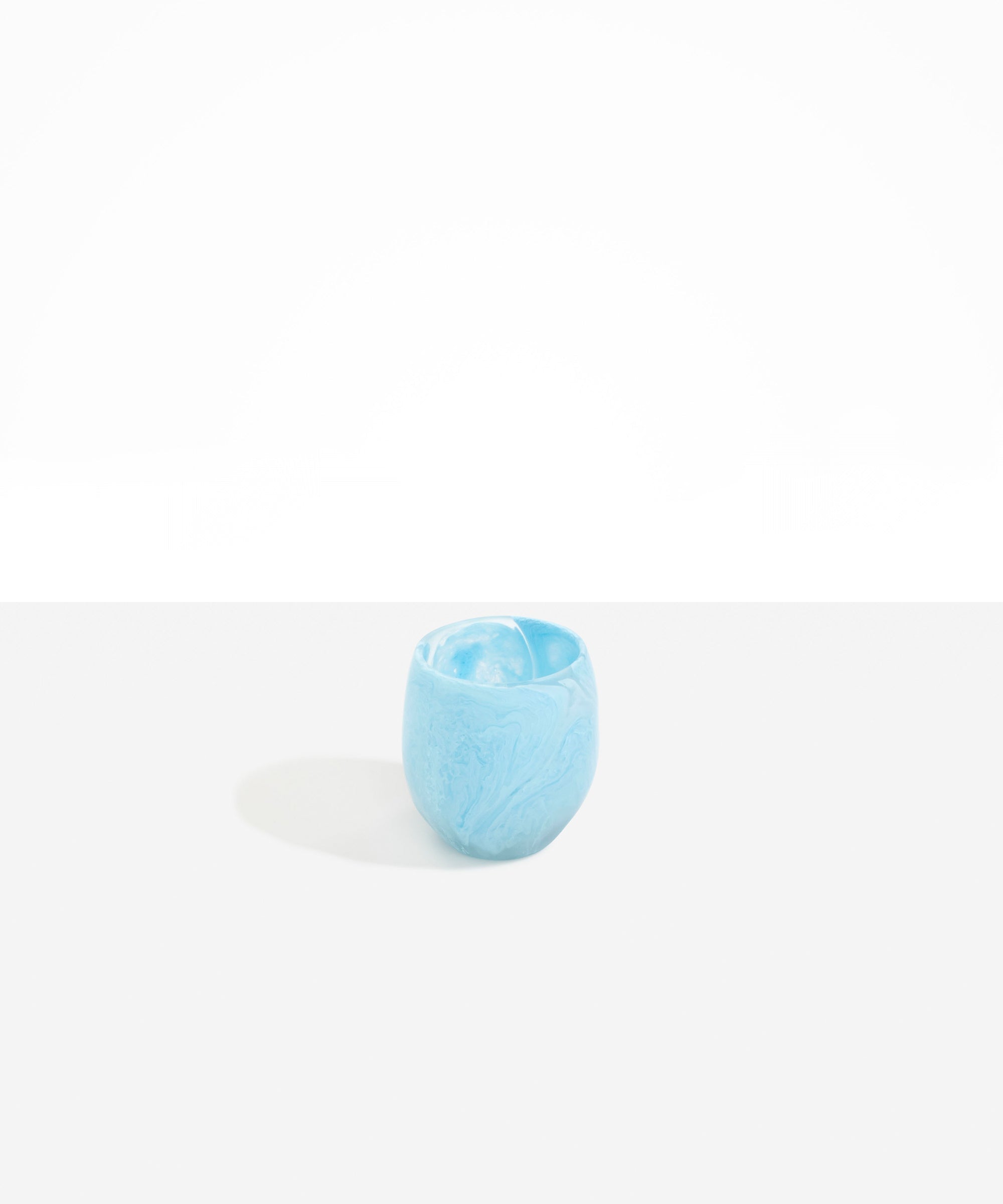 Dinosaur Designs Large Rock Cup in Pool — handcrafted marbled blue and transparent resin cup with rounded bulbous form and open organic rim