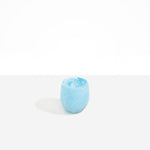 Dinosaur Designs Large Rock Cup in Pool — handcrafted marbled blue and transparent resin cup with rounded bulbous form and open organic rim