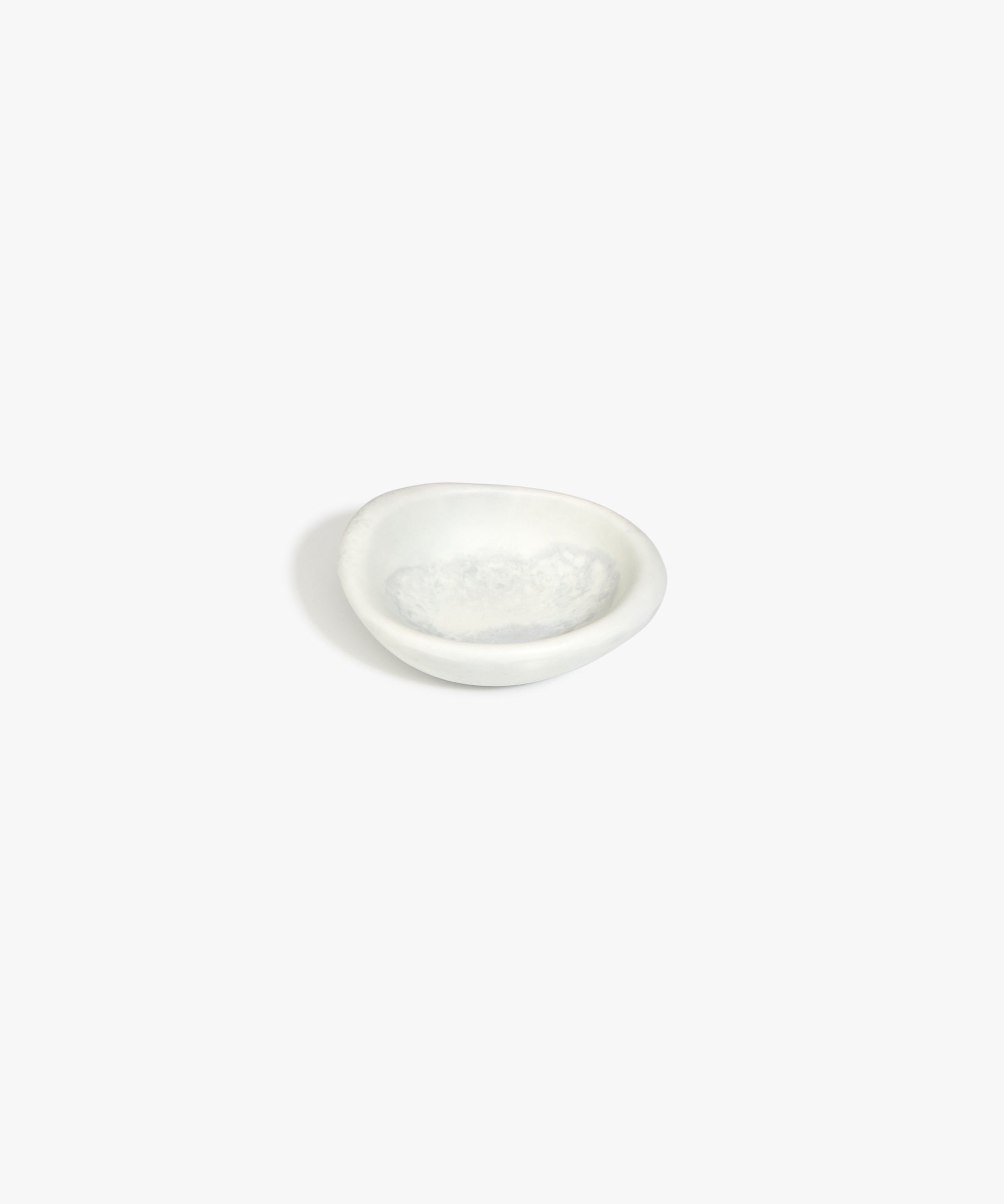 Dinosaur Designs Bones Dish in Cloud — small handcrafted grey and cream marbled resin trinket dish with organic form