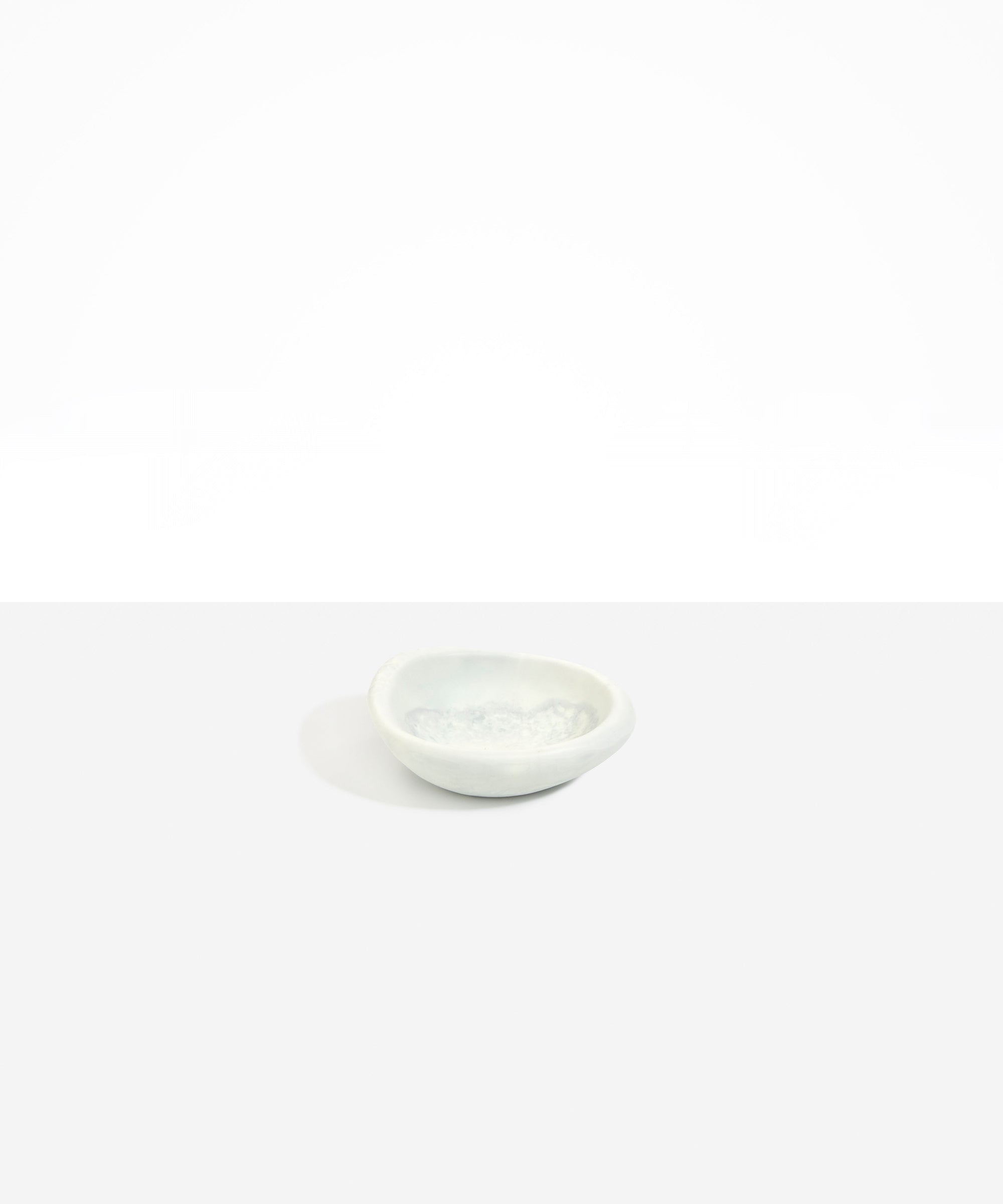 Dinosaur Designs Bones Dish in Cloud — small handcrafted grey and cream marbled resin trinket dish with organic form