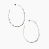 Dinosaur Designs Large Pebble Hoop Earrings in Silver-Plated Brass — polished silver-plated brass oversized oval hoop earrings with tapered wire and stud fastening