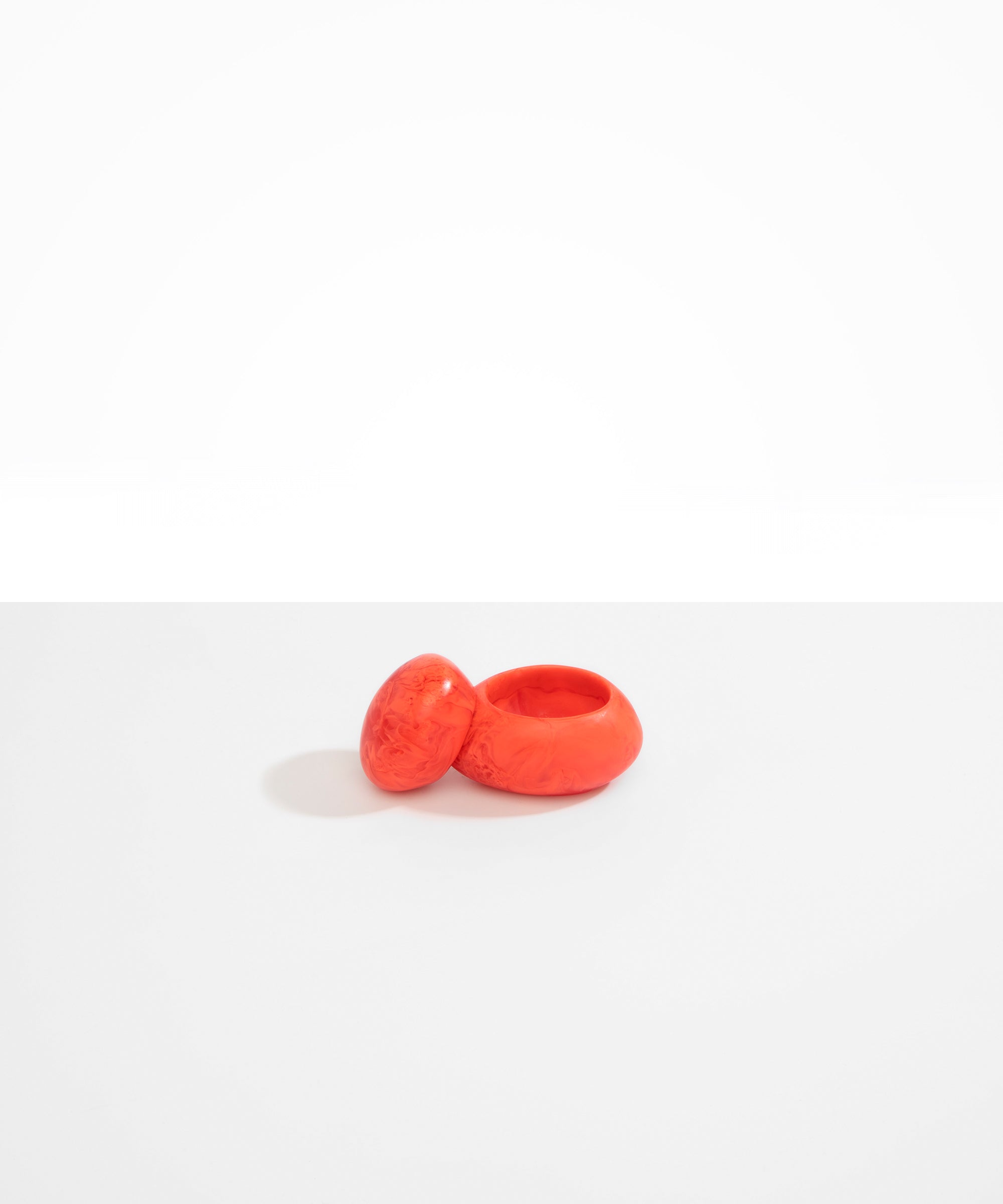 Dinosaur Designs JARPEBMED Medium Pebble Jar in Lychee orange color resin