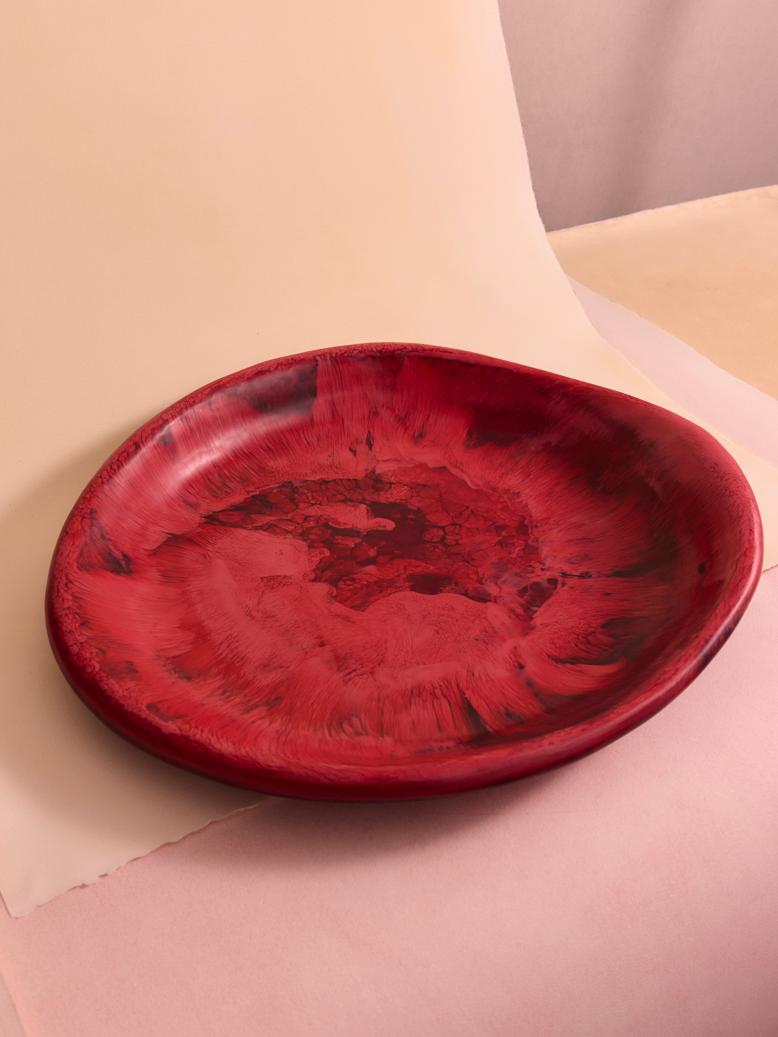 Deep pink serving bowl on a pink and beige backdrop