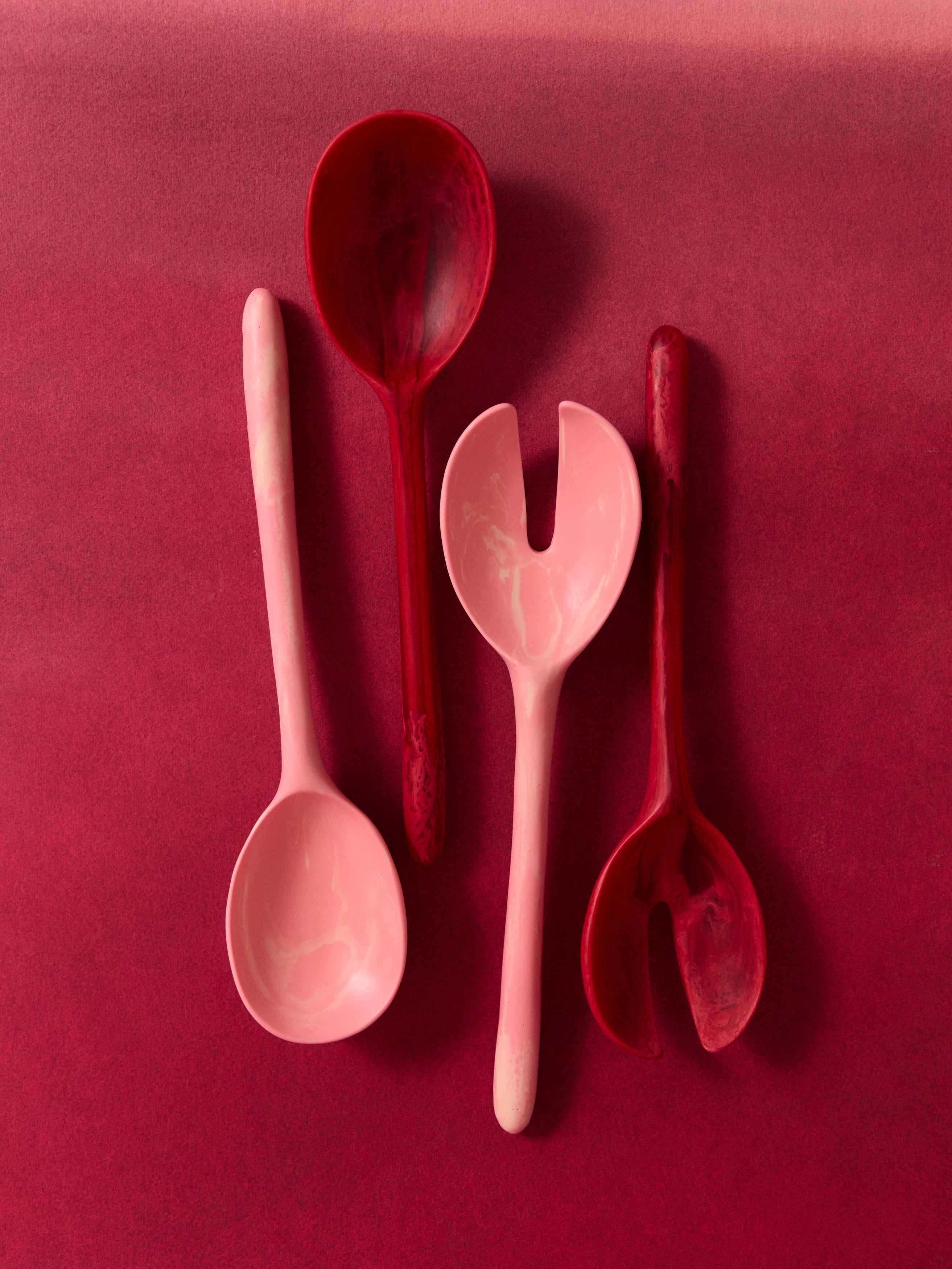 Dinosaur Designs handmade coloured red and pink resin salad servers