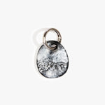 Dinosaur Designs Earth Keyring in Black Marble — handcrafted marbled Black and white resin pebble bead on a polished gunmetal jump ring..