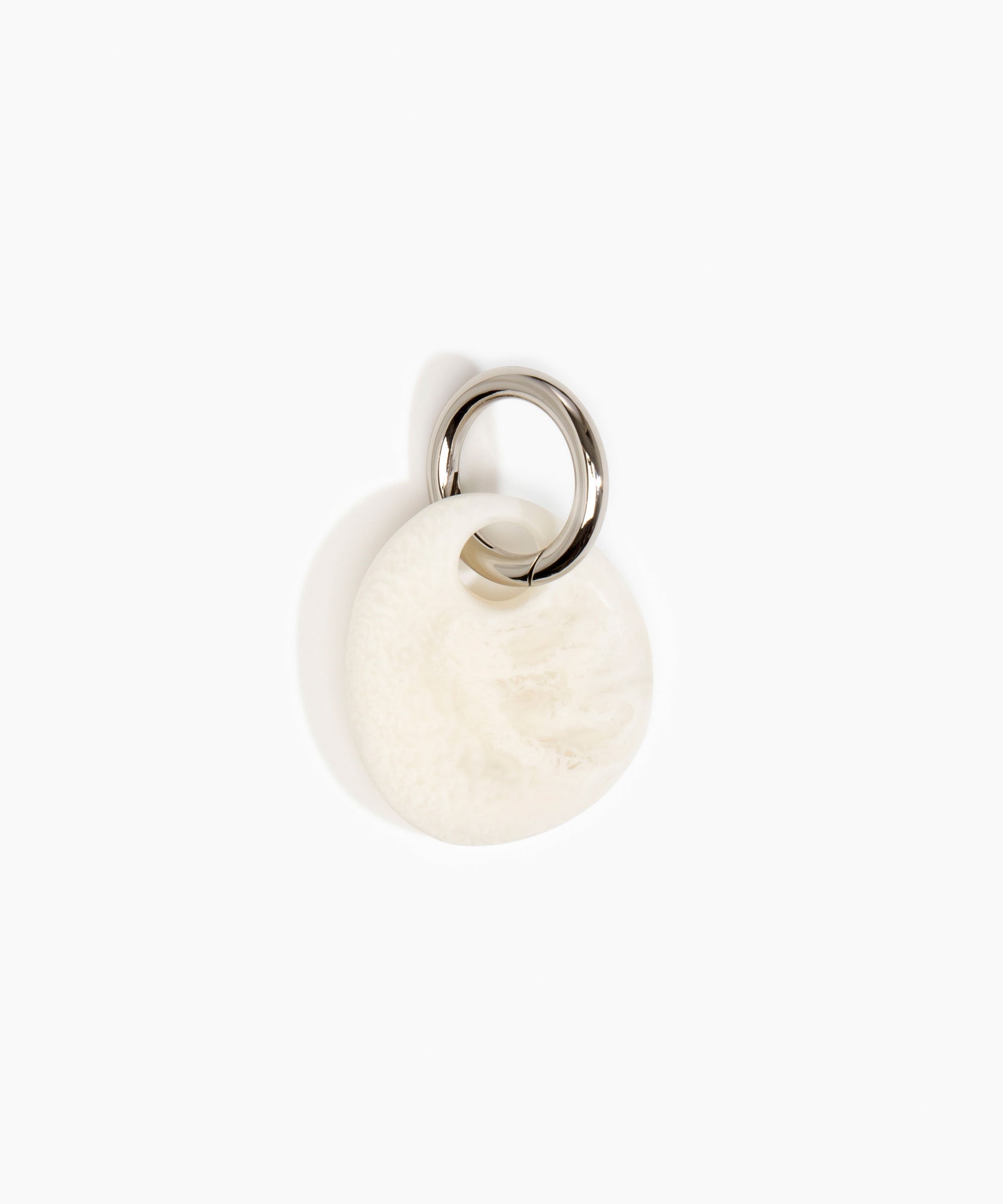 Dinosaur Designs Earth Keyring in Chalk Swirl — handcrafted marbled off white resin pebble bead on a polished gunmetal jump ring..