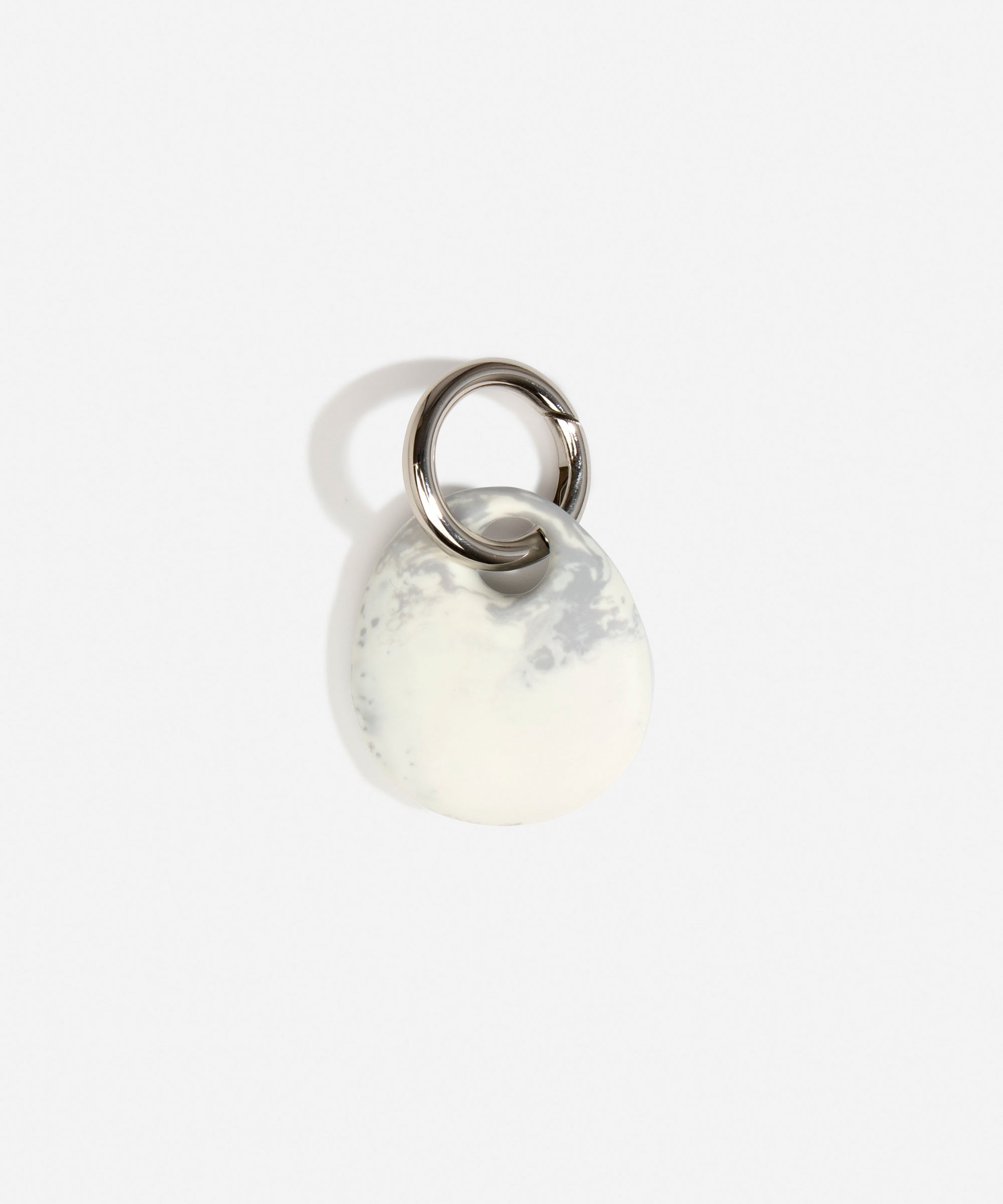 Dinosaur Designs Earth Keyring in Cloud — handcrafted marbled grey and Cream resin pebble bead on a polished gunmetal jump ring..