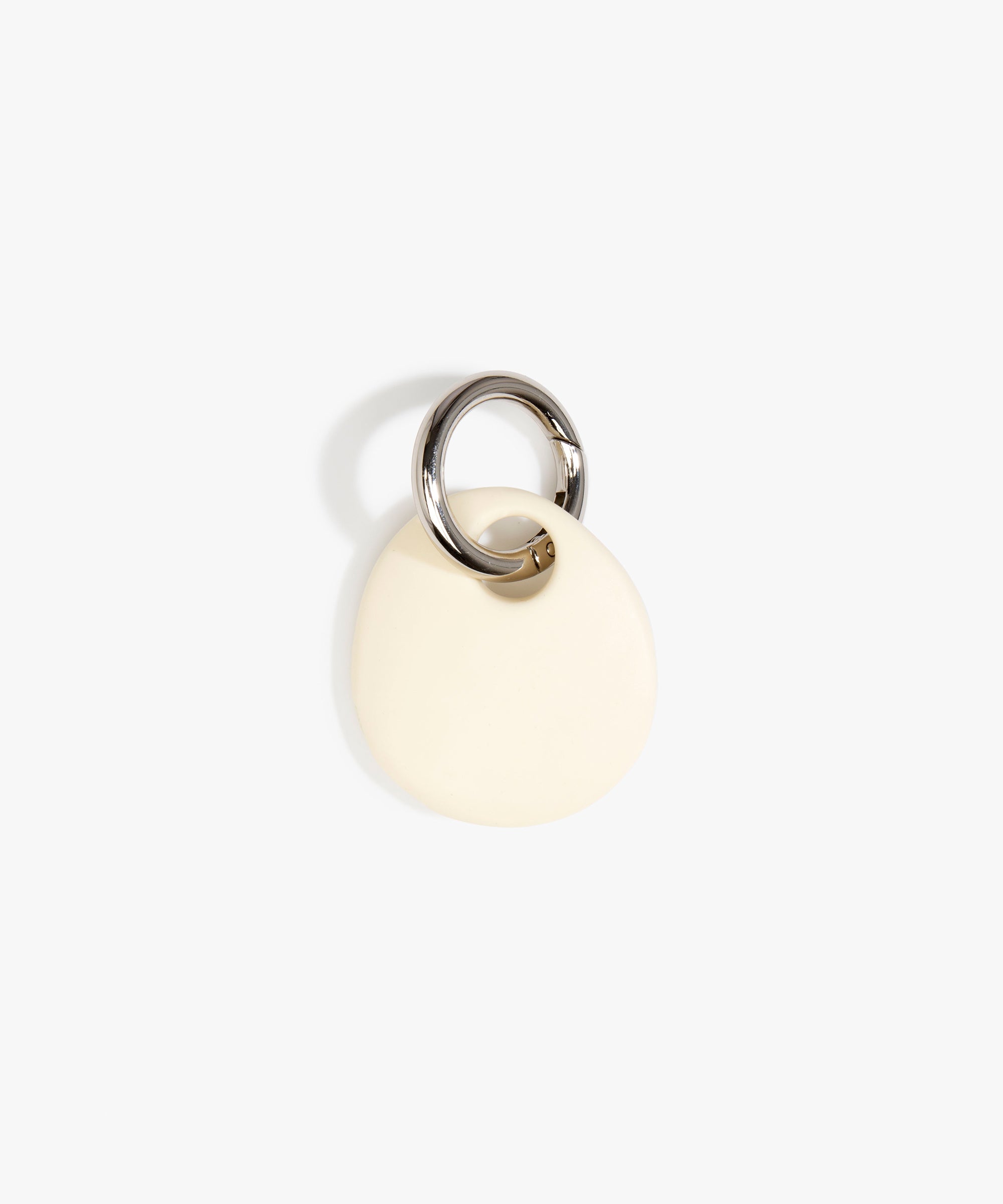 Dinosaur Designs Earth Keyring in Cream — handcrafted Cream resin pebble bead on a polished gunmetal jump ring..