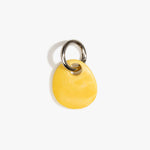 Dinosaur Designs Earth Keyring in Daisy — handcrafted marbled light and dark yellow resin pebble bead on a polished gunmetal jump ring..