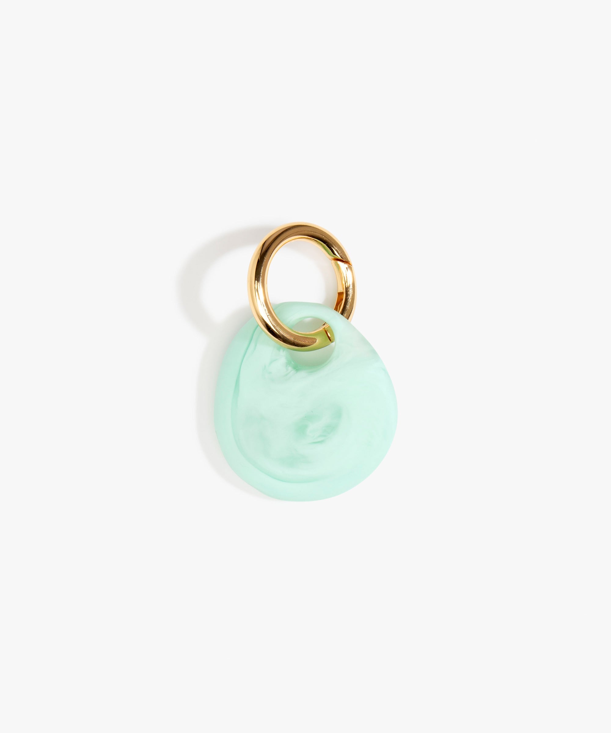 Dinosaur Designs Earth Keyring in Mint— handcrafted marbled green blue resin pebble bead on a polished brass jump ring..