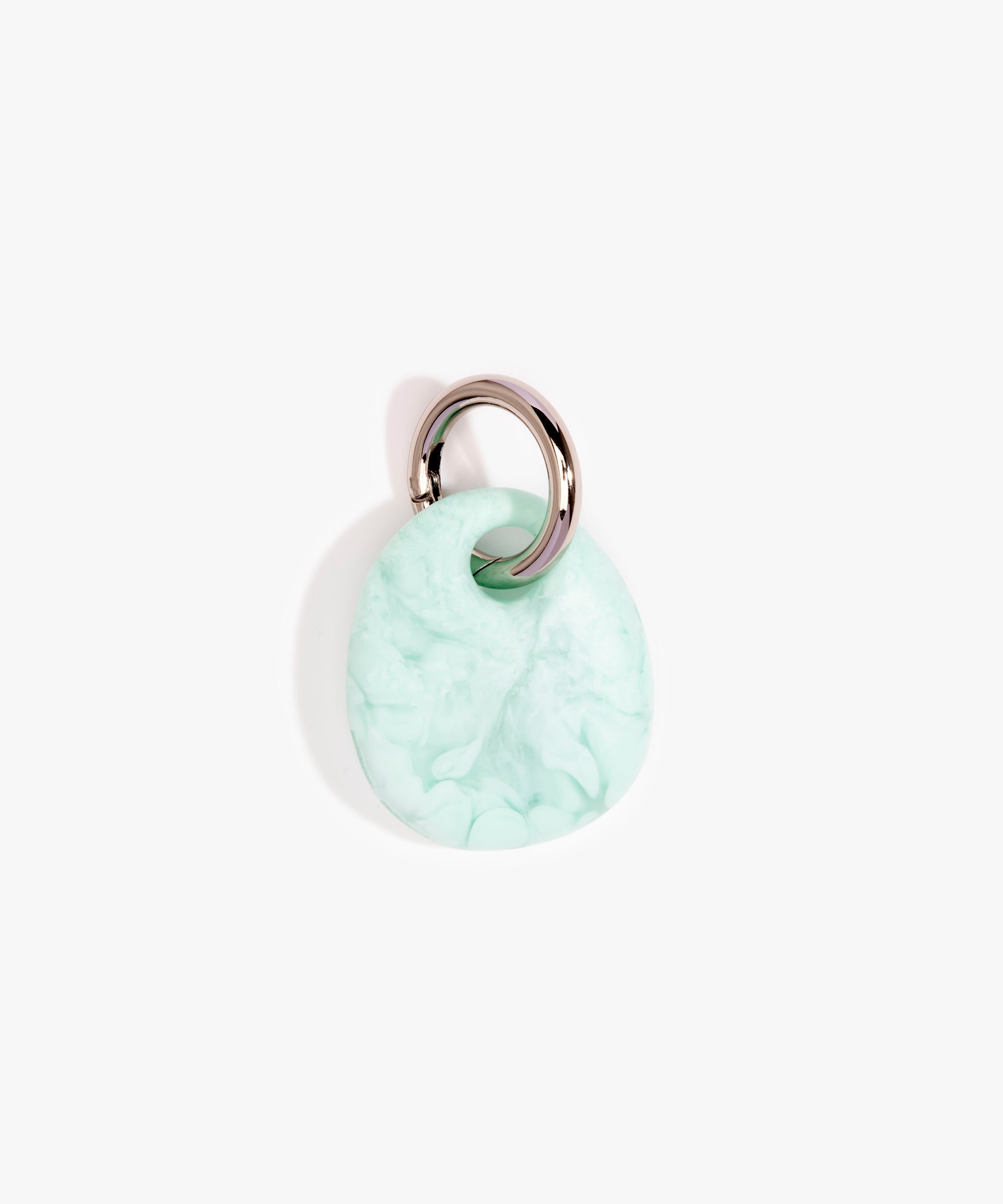 Dinosaur Designs Earth Keyring in Mint— handcrafted marbled green blue resin pebble bead on a polished gunmetal jump ring..