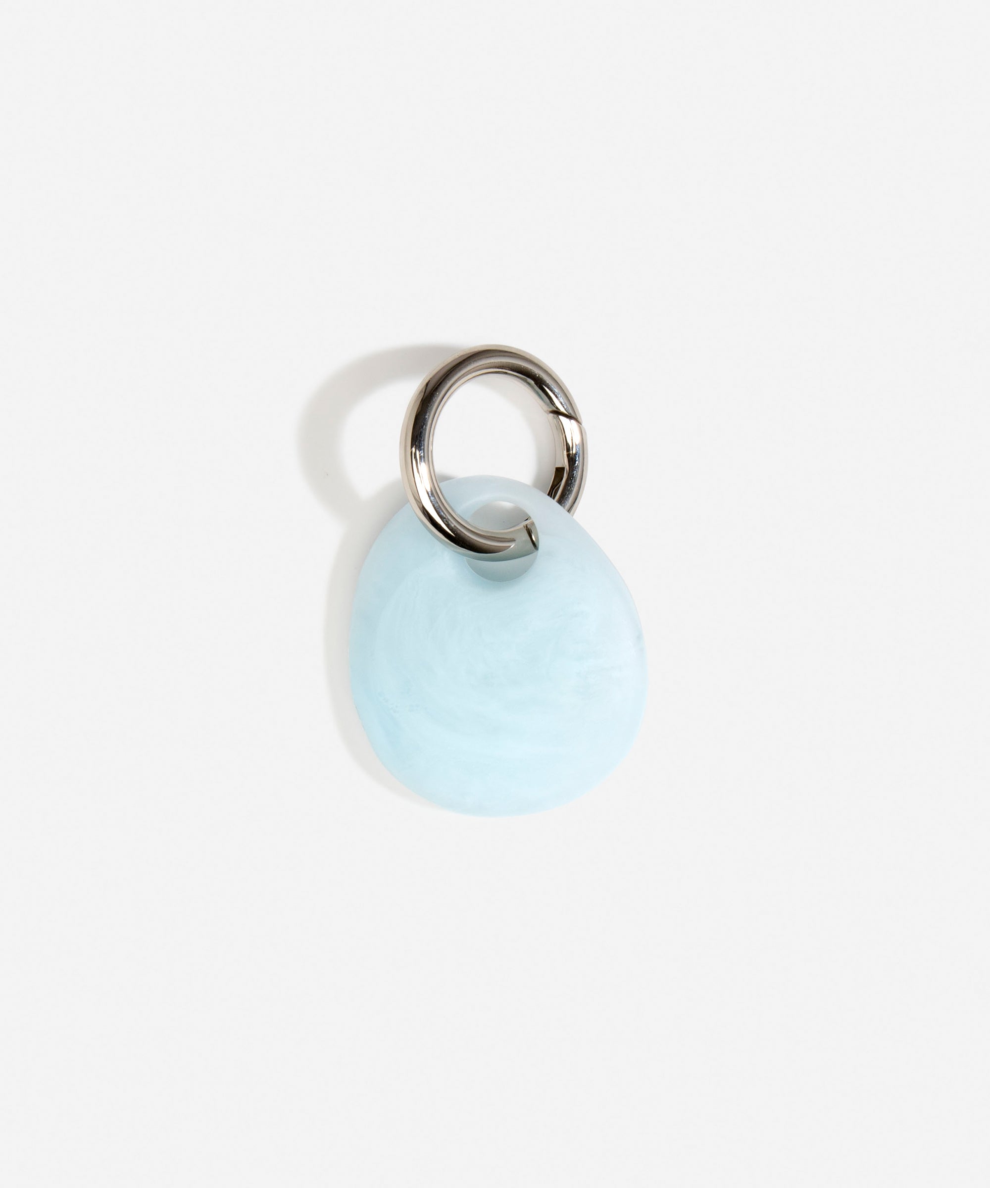Dinosaur Designs Earth Keyring in Pool — handcrafted marbled blue and clear resin pebble bead on a polished gunmetal jump ring..