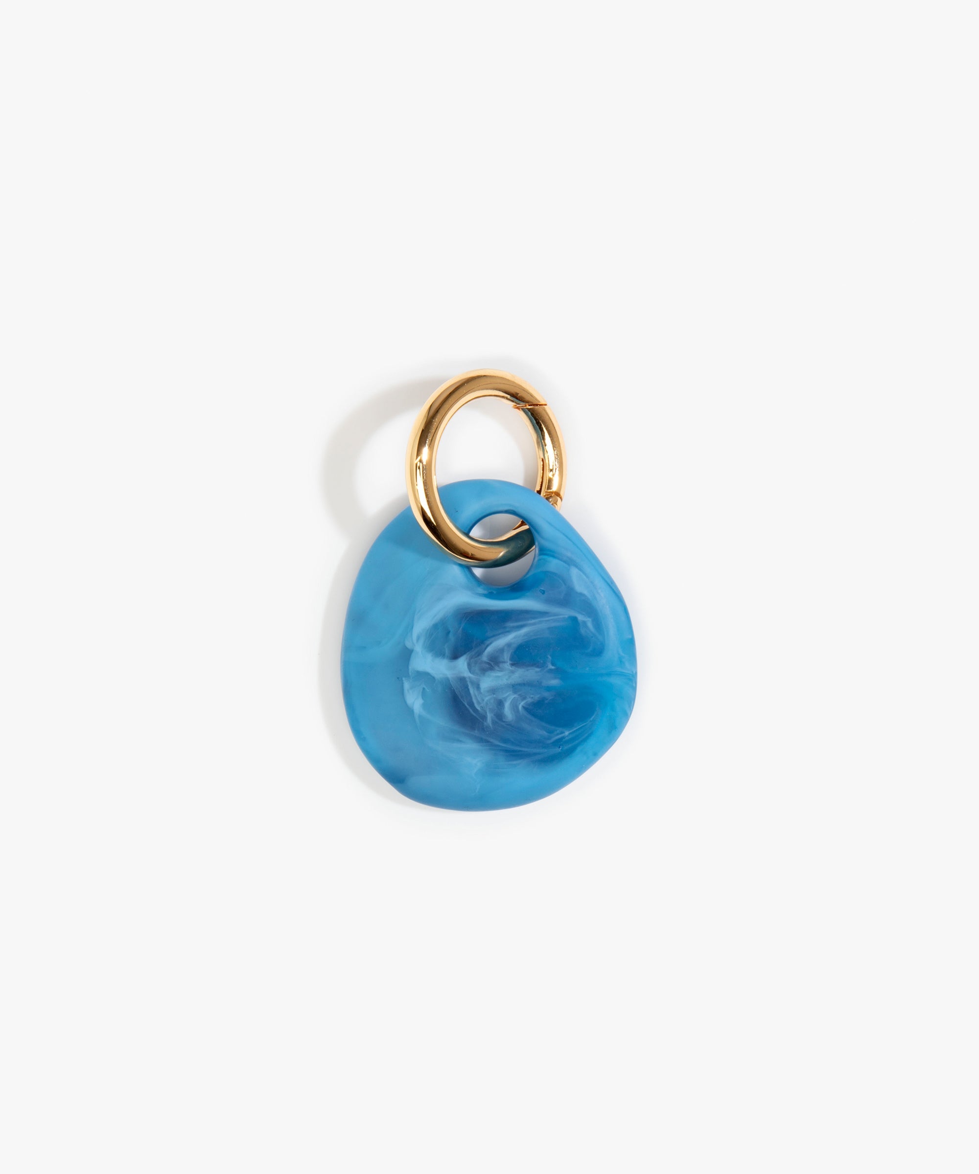 Dinosaur Designs Earth Keyring in Sky — handcrafted marbled blue and clear resin pebble bead on a polished brass jump ring..