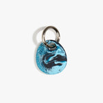 Dinosaur Designs Earth Keyring in Water — handcrafted marbled light and dark blue resin pebble bead on a polished gunmetal jump ring..