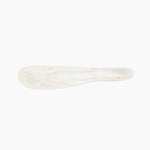 Dinosaur Designs Temple Cake Knife in Chalk Swirl — handcrafted marbled off white resin cake knife with smooth tapered blade and rounded handle.