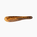 Dinosaur Designs Temple Cake Knife in Dark Horn — handcrafted marbled brown, black and gold resin cake knife with smooth tapered blade and rounded handle.