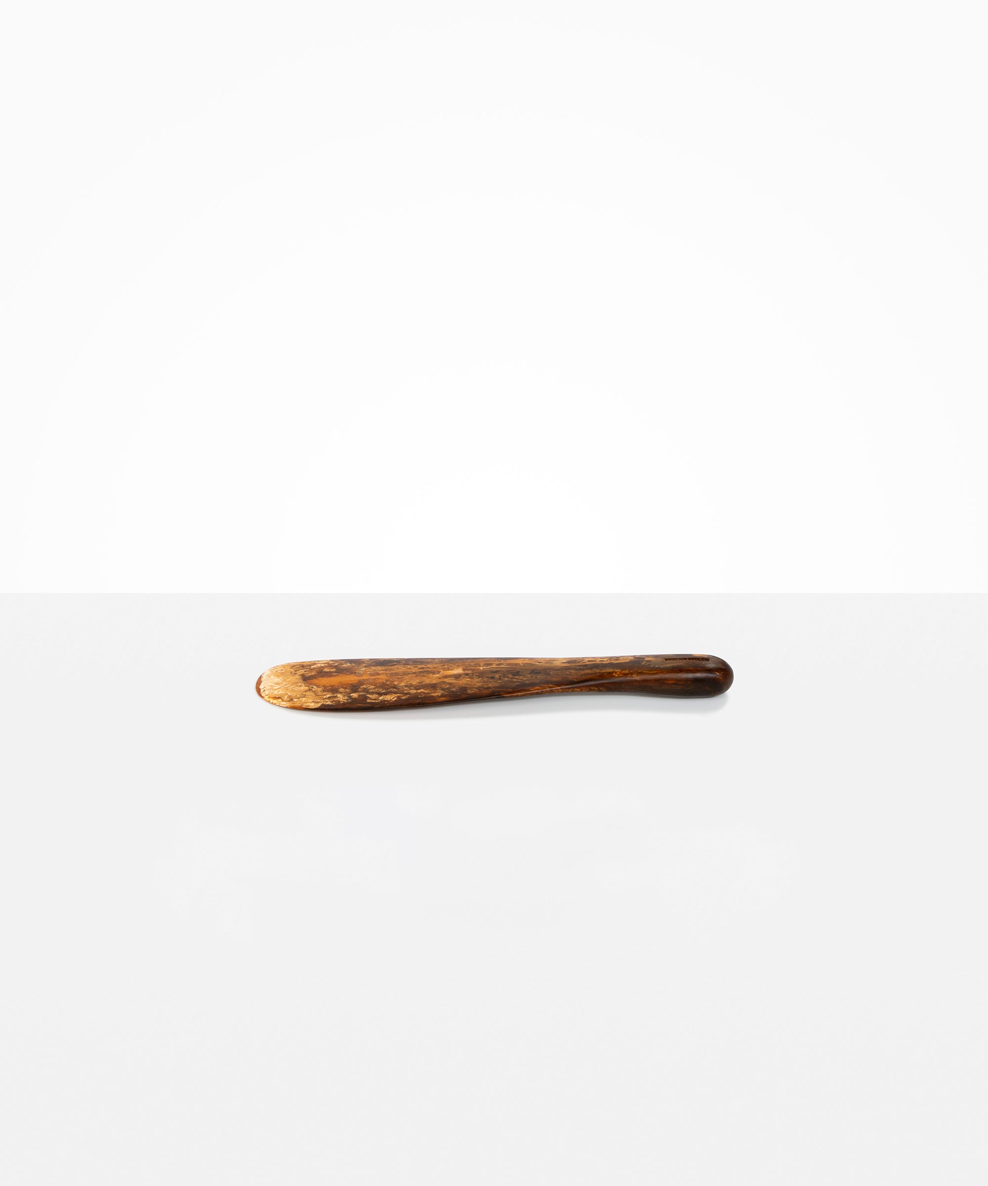 Dinosaur Designs Temple Cake Knife in Dark Horn — handcrafted marbled brown, black and gold resin cake knife with smooth tapered blade and rounded handle.