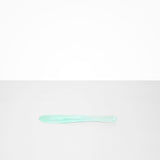 Dinosaur Designs Temple Cake Knife in Mint — handcrafted marbled green blue resin cake knife with smooth tapered blade and rounded handle.