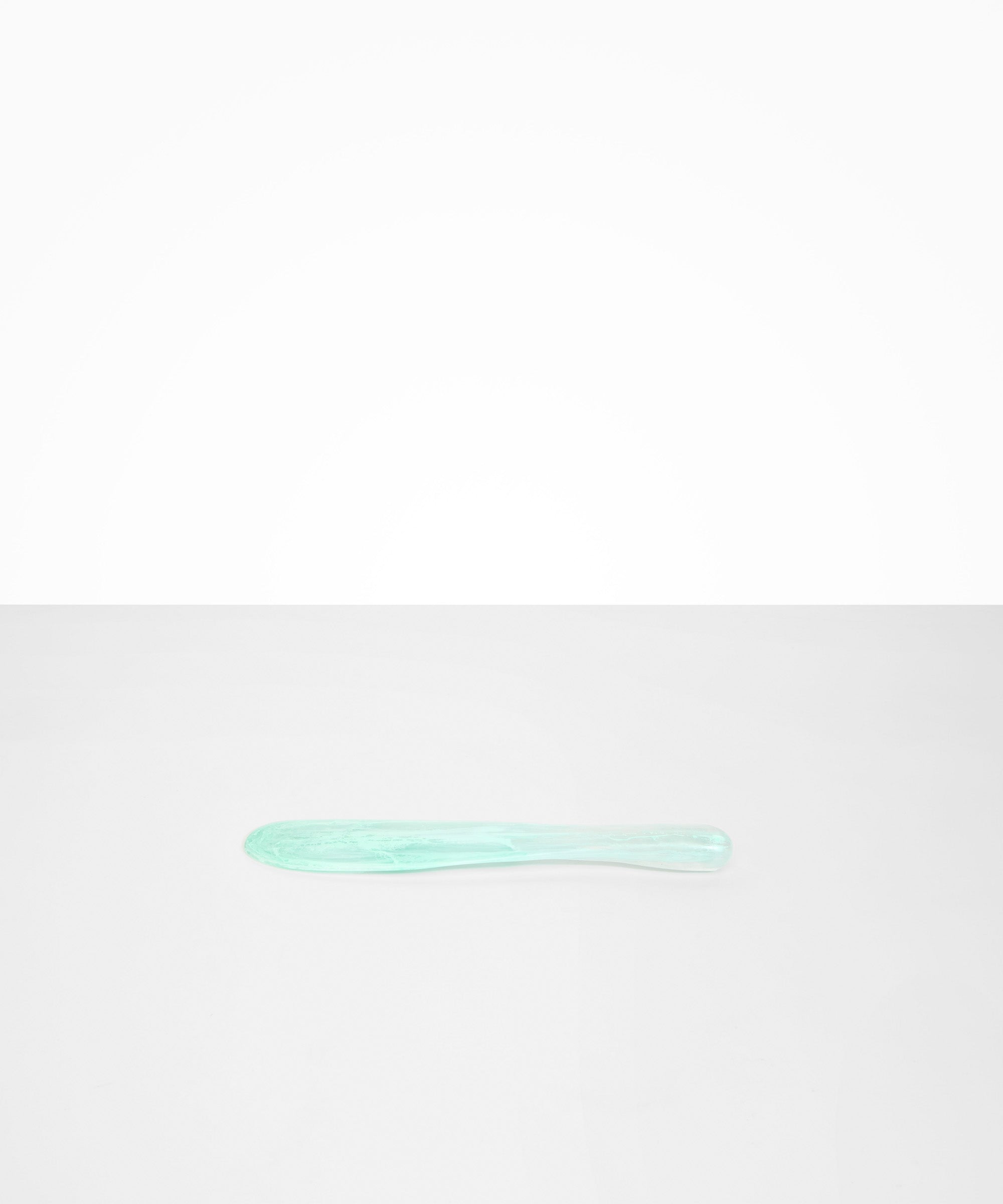 Dinosaur Designs Temple Cake Knife in Mint — handcrafted marbled green blue resin cake knife with smooth tapered blade and rounded handle.